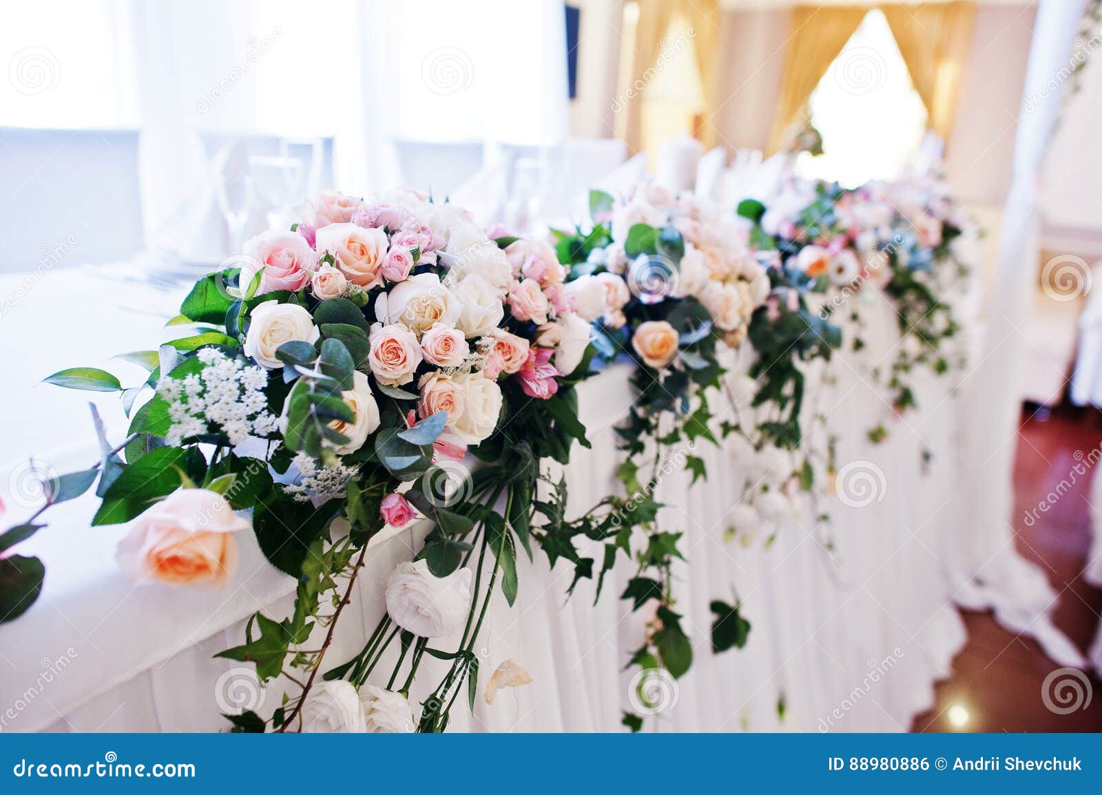 Flowers on Table of Newlyweds at Wedding Reception. Stock Photo Image