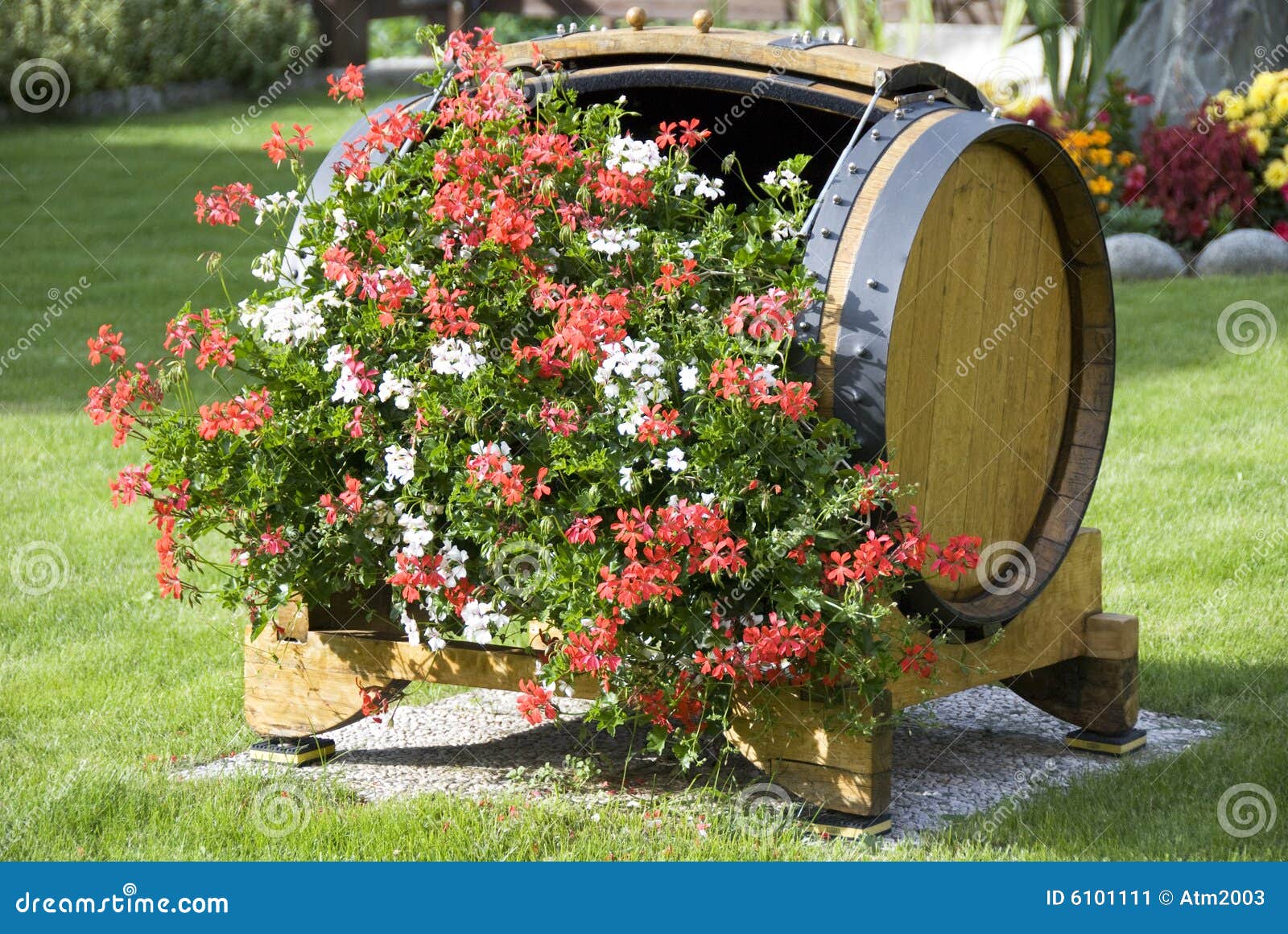 Flowers in a wood barrel stock image. Image of blue, feast 6101111