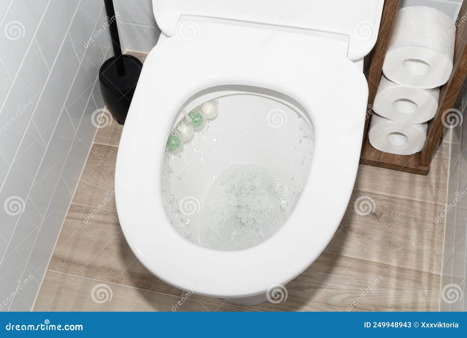 Flushing Toilet Bowl in Restroom with Accessories Stock Image Image