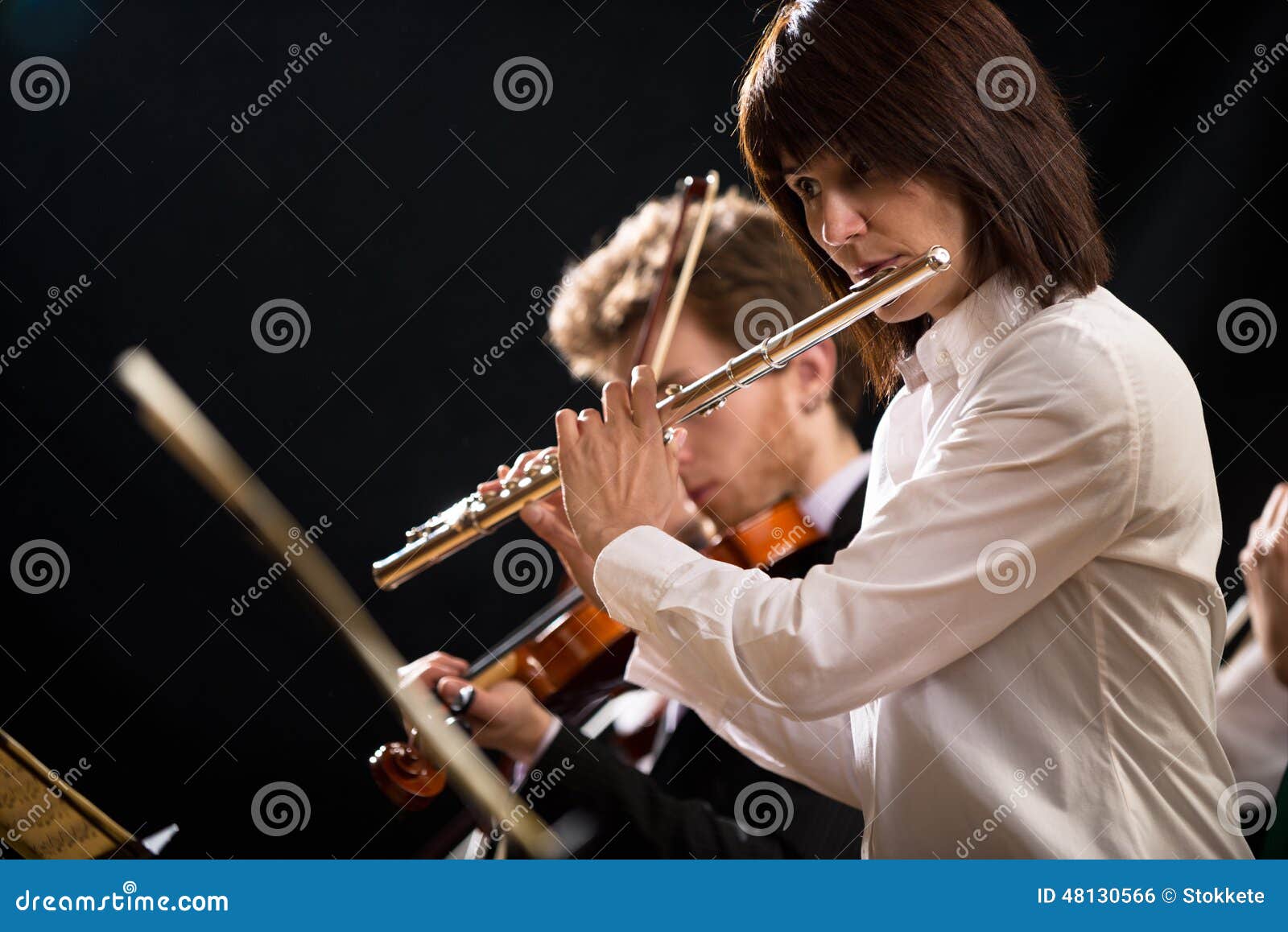 Flutist on stage stock photo. Image of instrument, musical 48130566