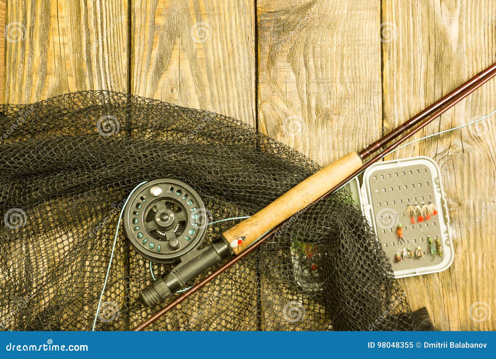 Fly Fishing Rod ,flie and a Landing Net on the Old Wooden Table. All Ready  for Fishing. Stock Image - Image of outdoor, flie: 98048355