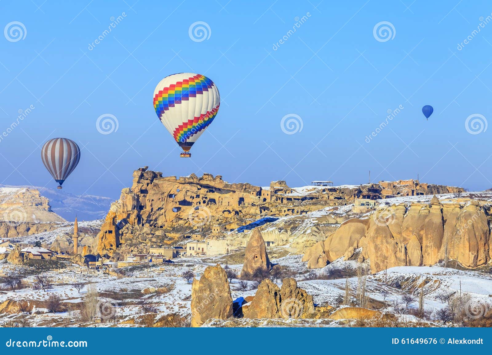 flying balloons over mountains at sunset. capadocia. turkey.