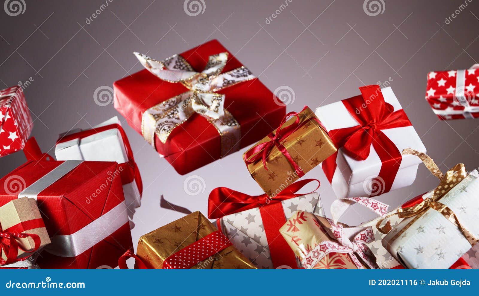 Flying Christmas Gifts on Coloured Background Stock Photo - Image of ...