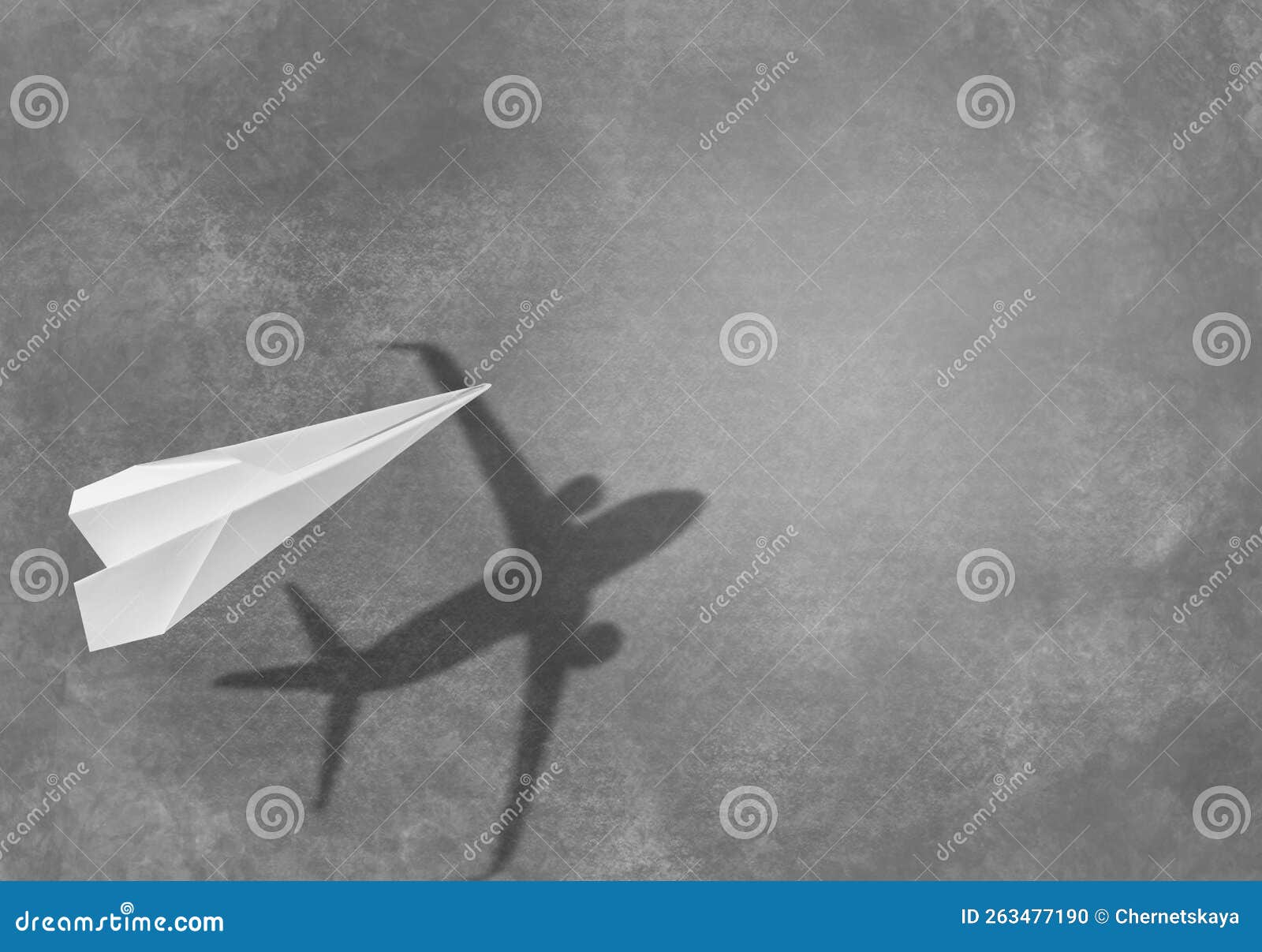 Flying Paper Plane and Shadow of a Real Airplane on Asphalt Stock Photo ...