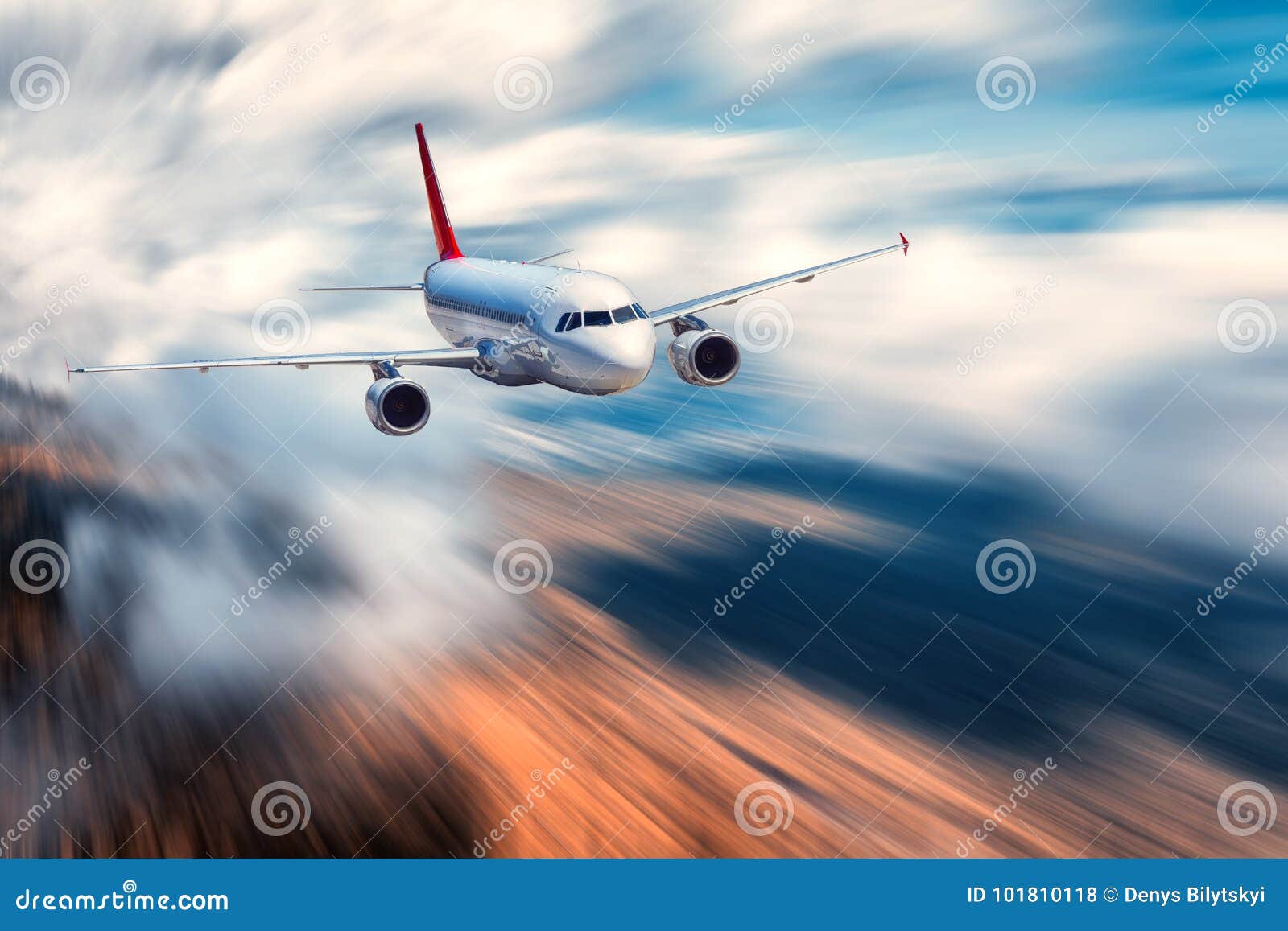 flying passenger airplane and blurred background