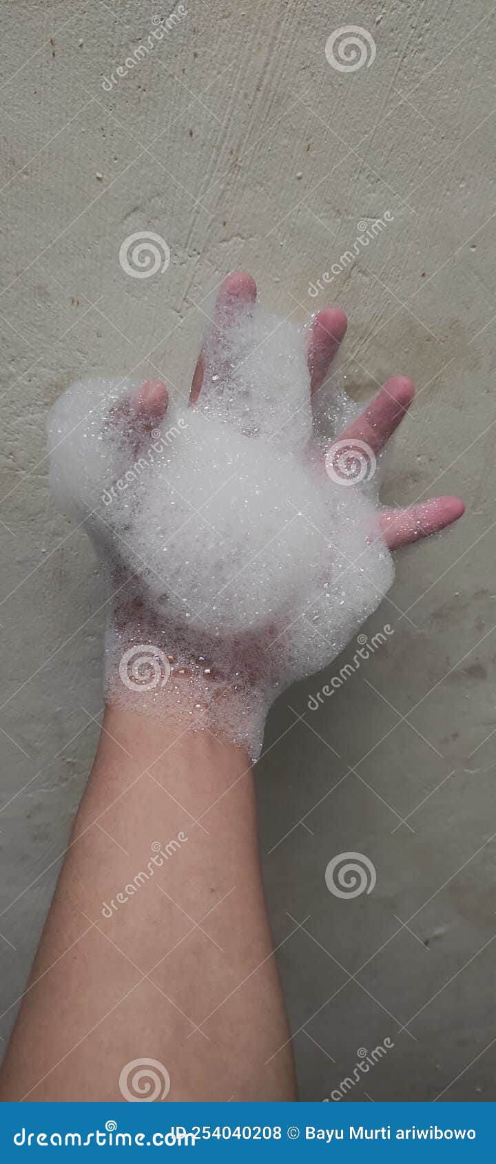 Foam on hand with bubbles, stock photo. Image of white 254040208