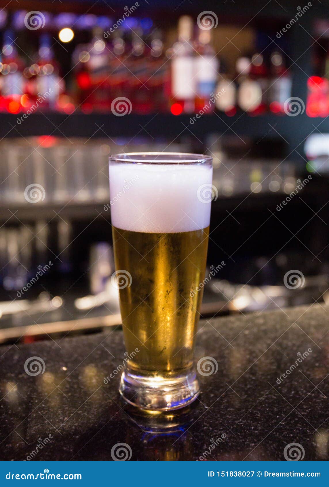 FOAMING COLD BEER AT BAR stock image. Image of bottle 151838027