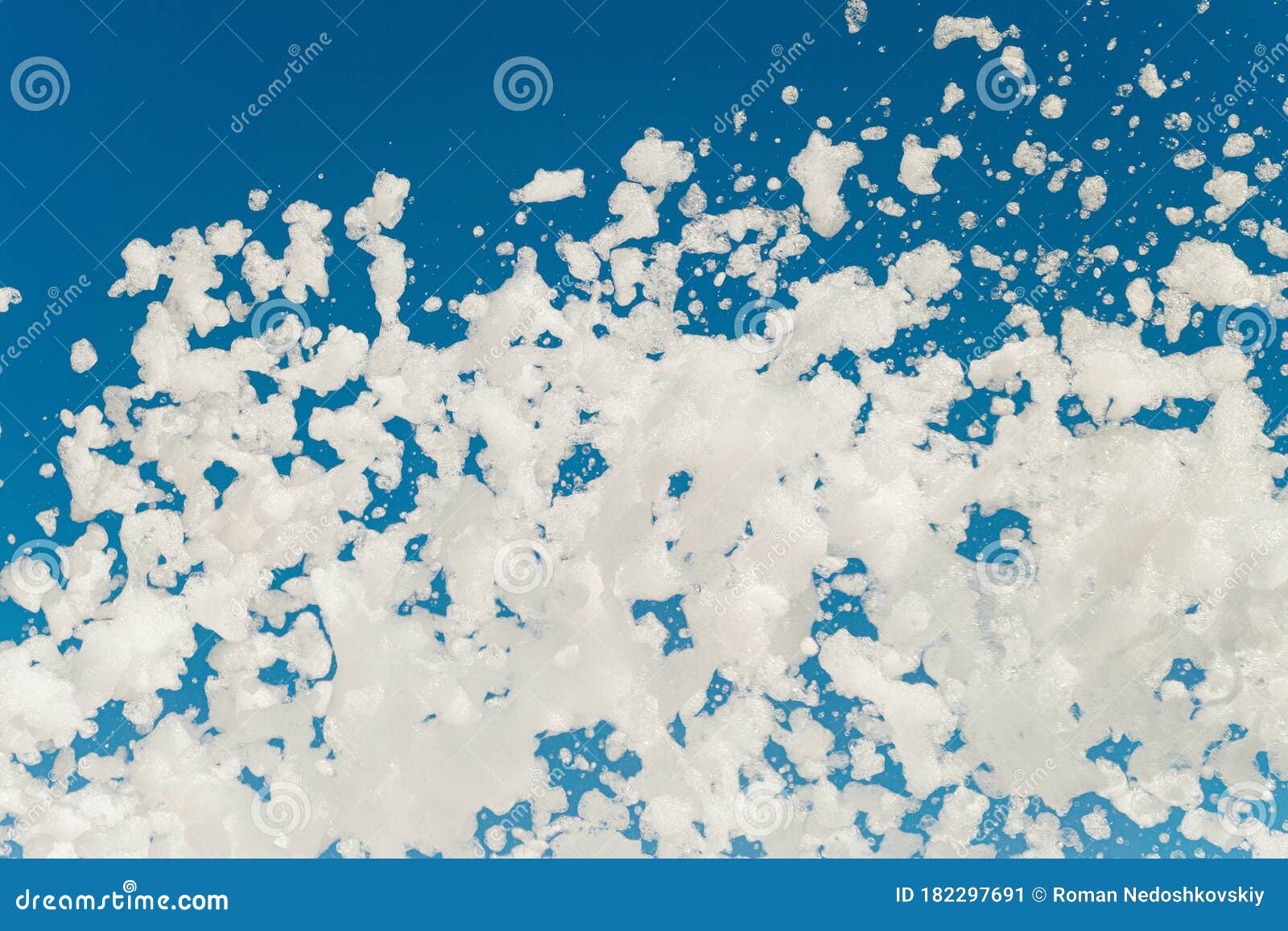 White Airy Foam on a Blue Sky Background Blowing from Lather Maker Gun  Stock Image - Image of amusement, blowed: 182297691