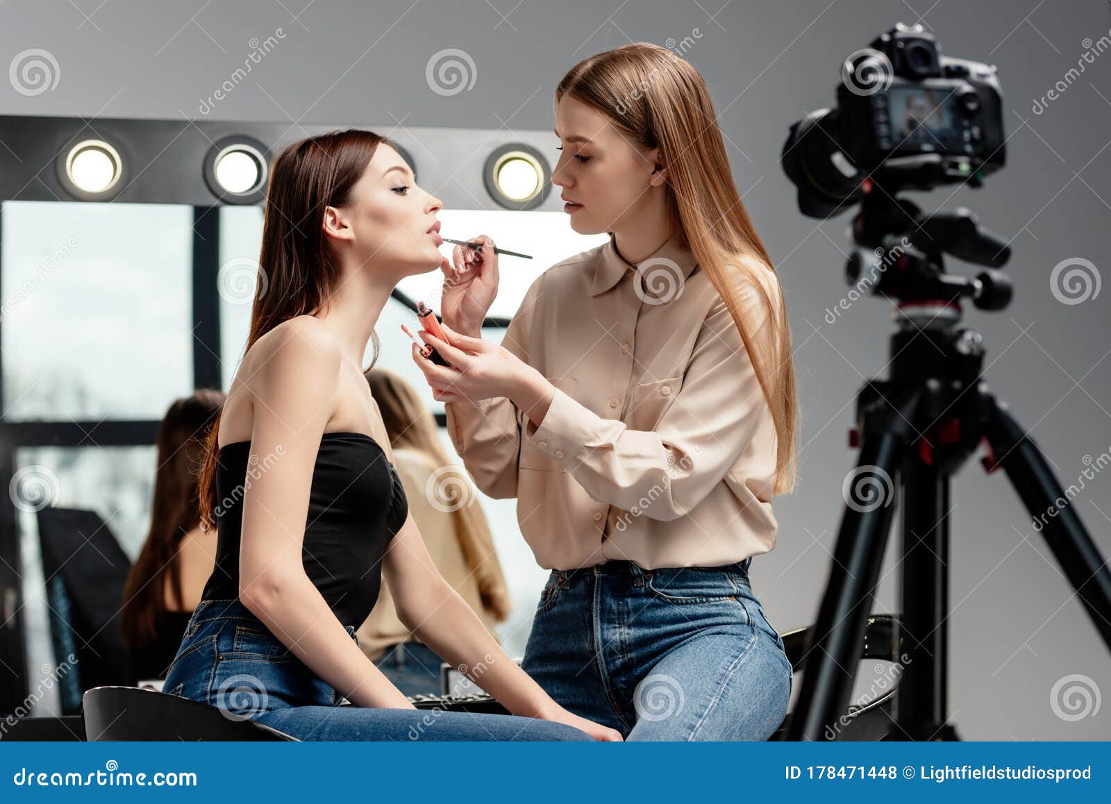 Focus Of Makeup Artist Applying Lip Gloss On Lips Of ...
