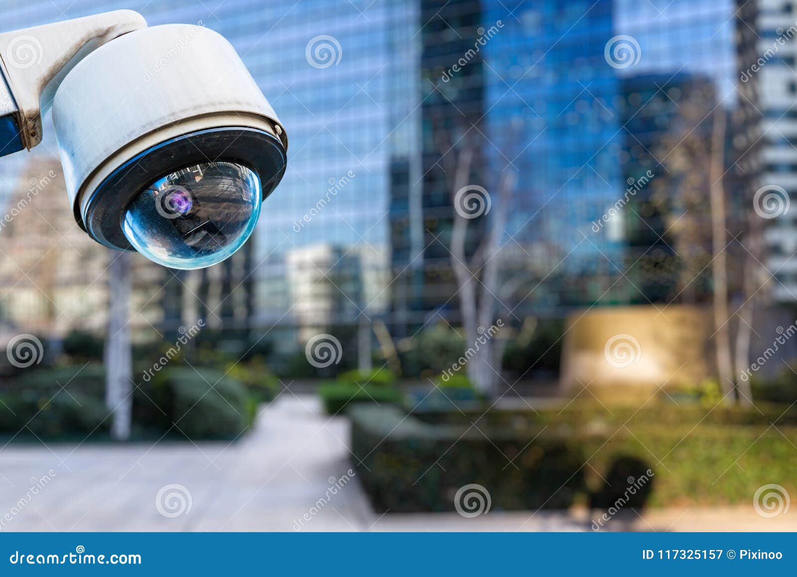 security cctv camera or surveillance system with buildings on blurry background