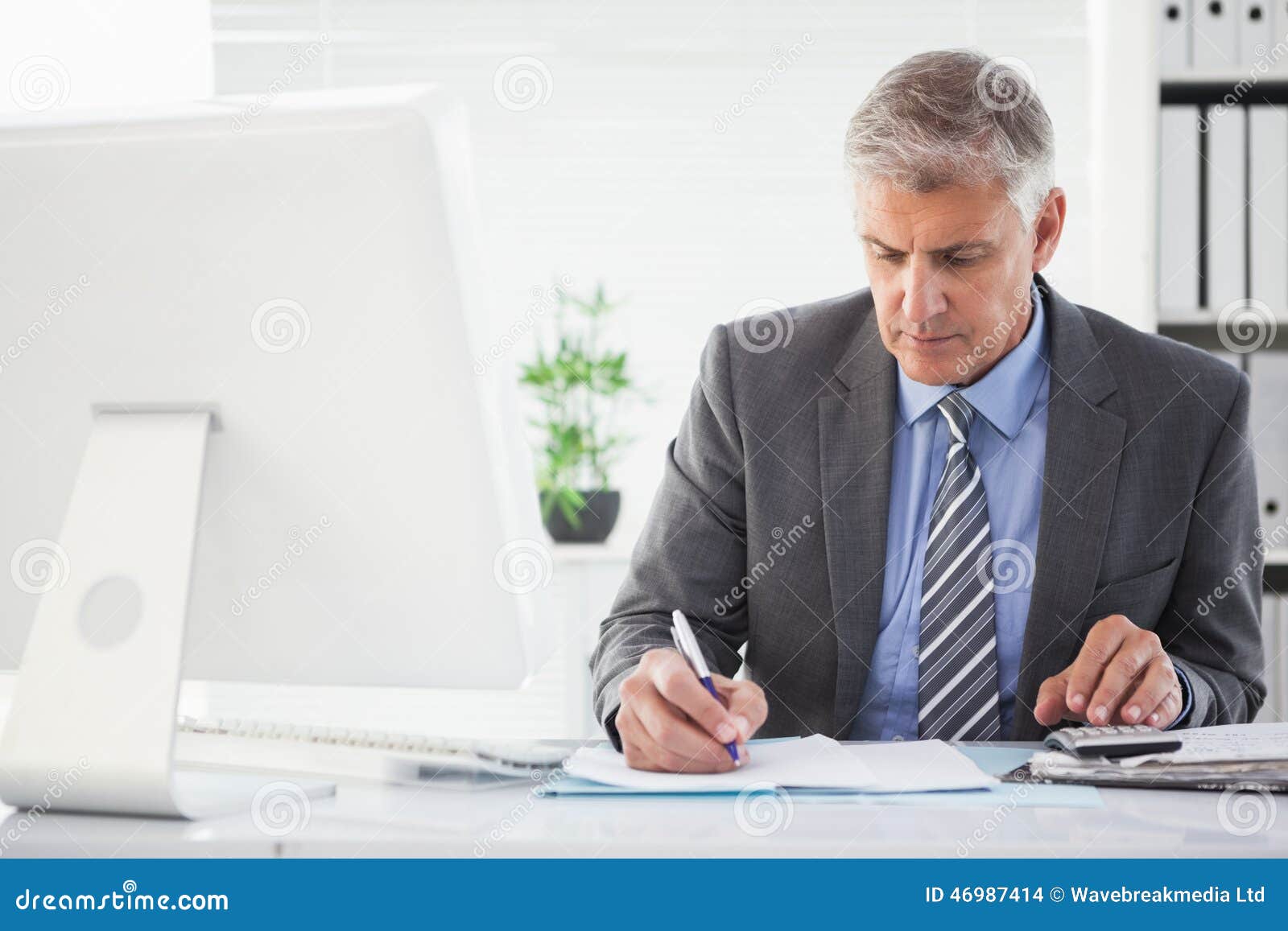 Focused Businessman Writing Something Down Stock Photo Image of