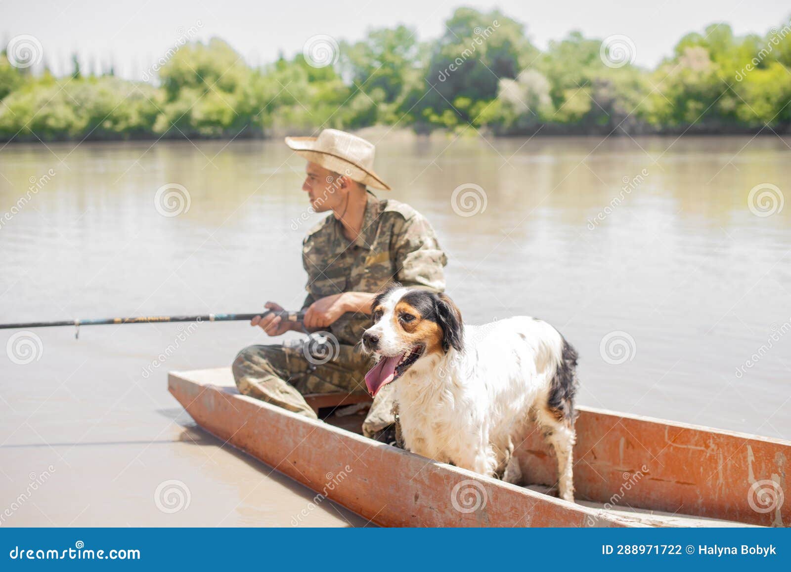 Focused Fisherman with Dog, Looking at Float, while Holding Fishing Rod and  Floating. Stock Photo - Image of fishing, space: 288971722