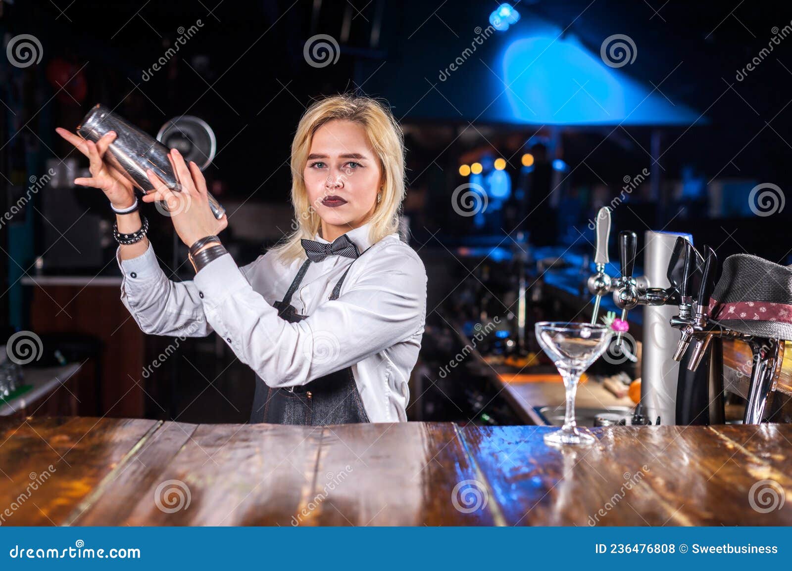 Confident Girl Barkeeper Pouring Fresh Alcoholic Drink into the Glasses ...