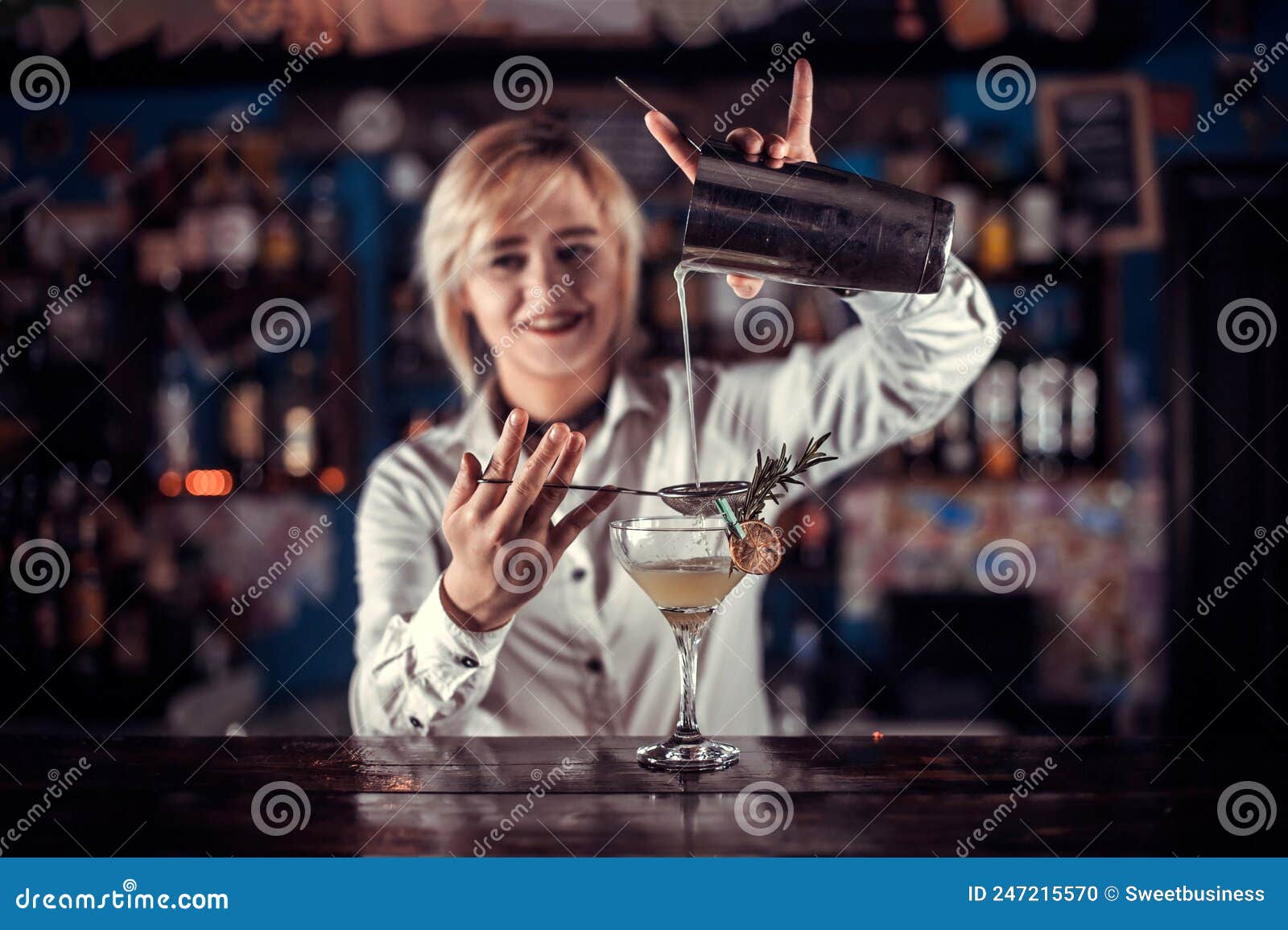 Confident Woman Tapster Makes a Show Creating a Cocktail while Standing ...