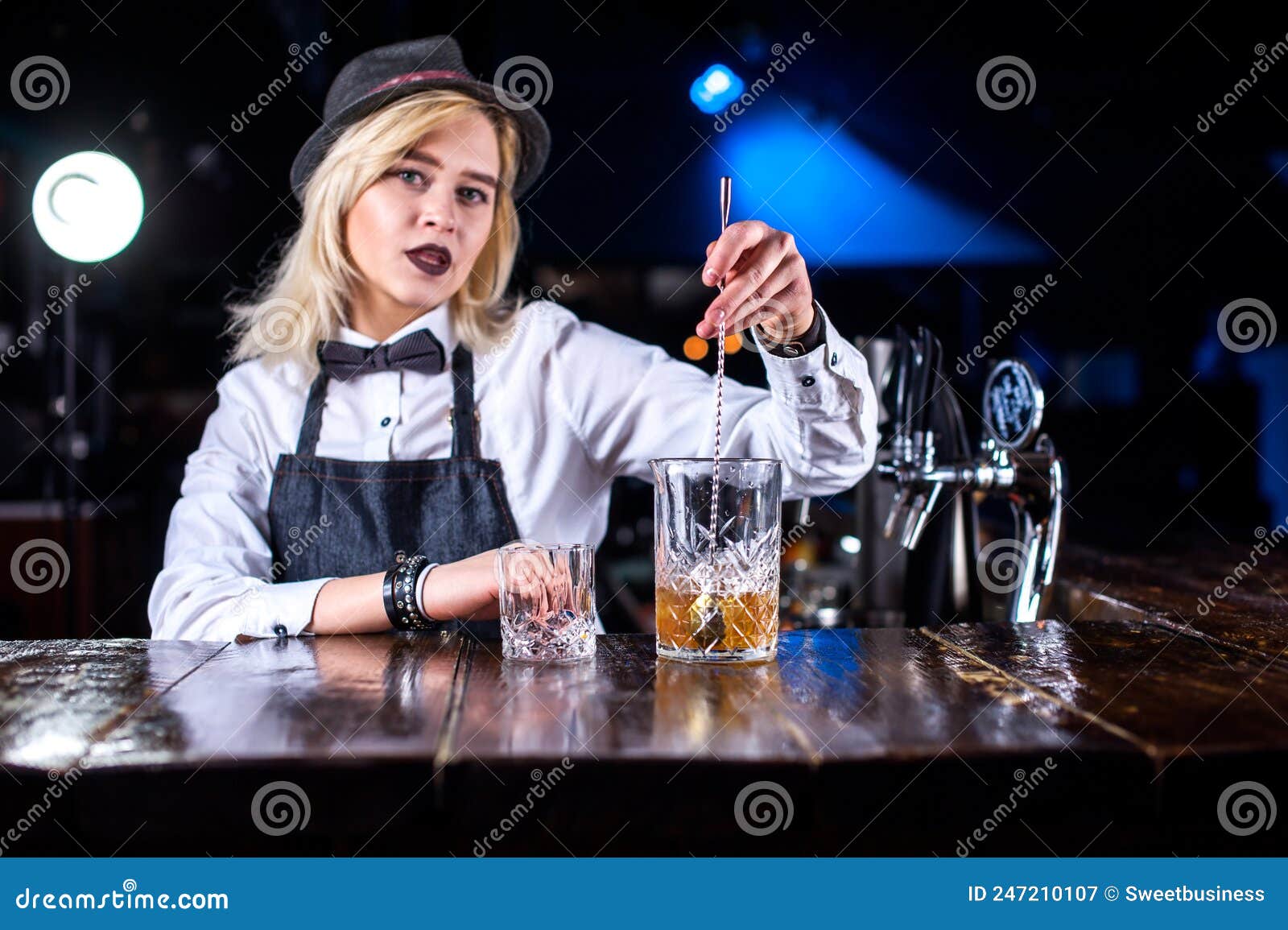 Focused Girl Bartending Pouring Fresh Alcoholic Drink into the Glasses ...