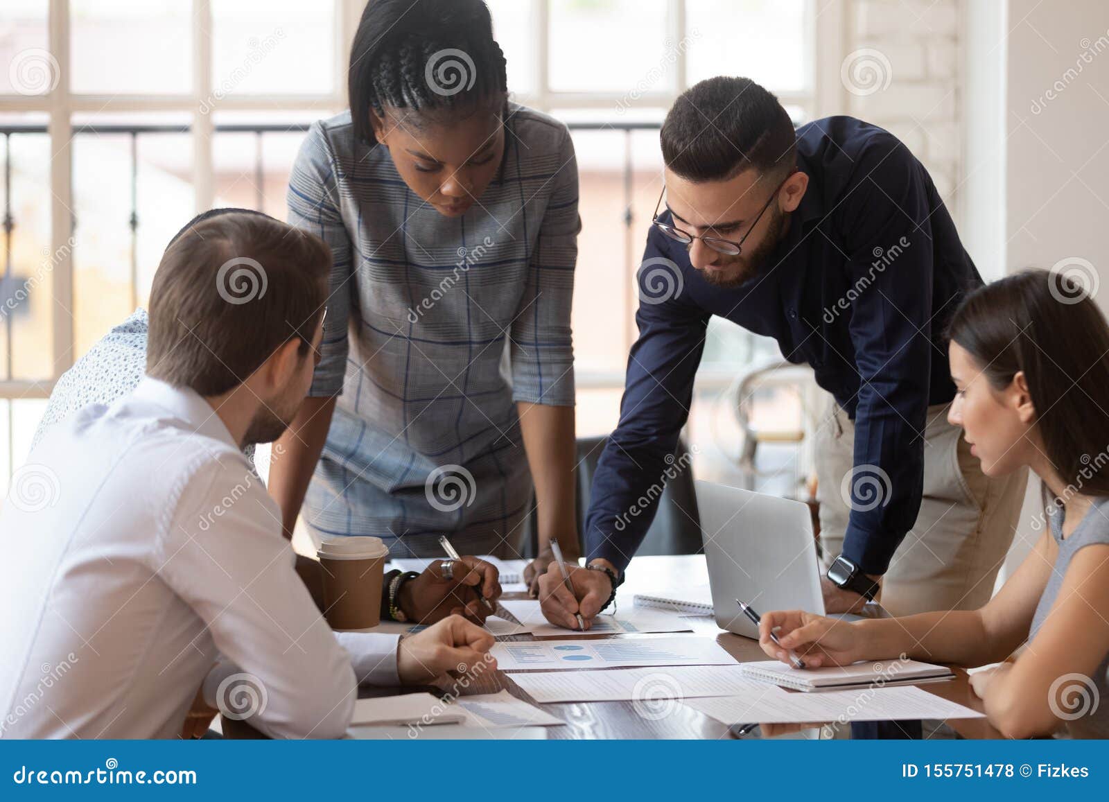 focused multiracial corporate business team people brainstorm on paperwork