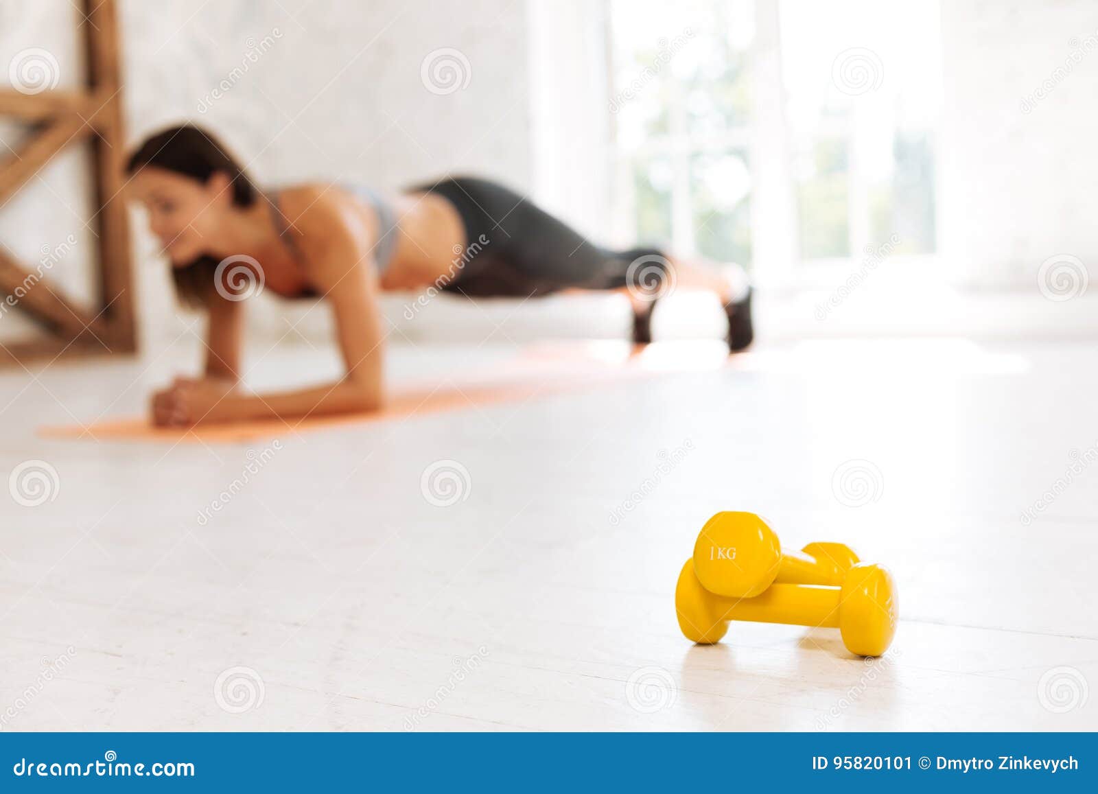 Focused Photo On Yellow Dumbbells That Lying On The Floor Stock