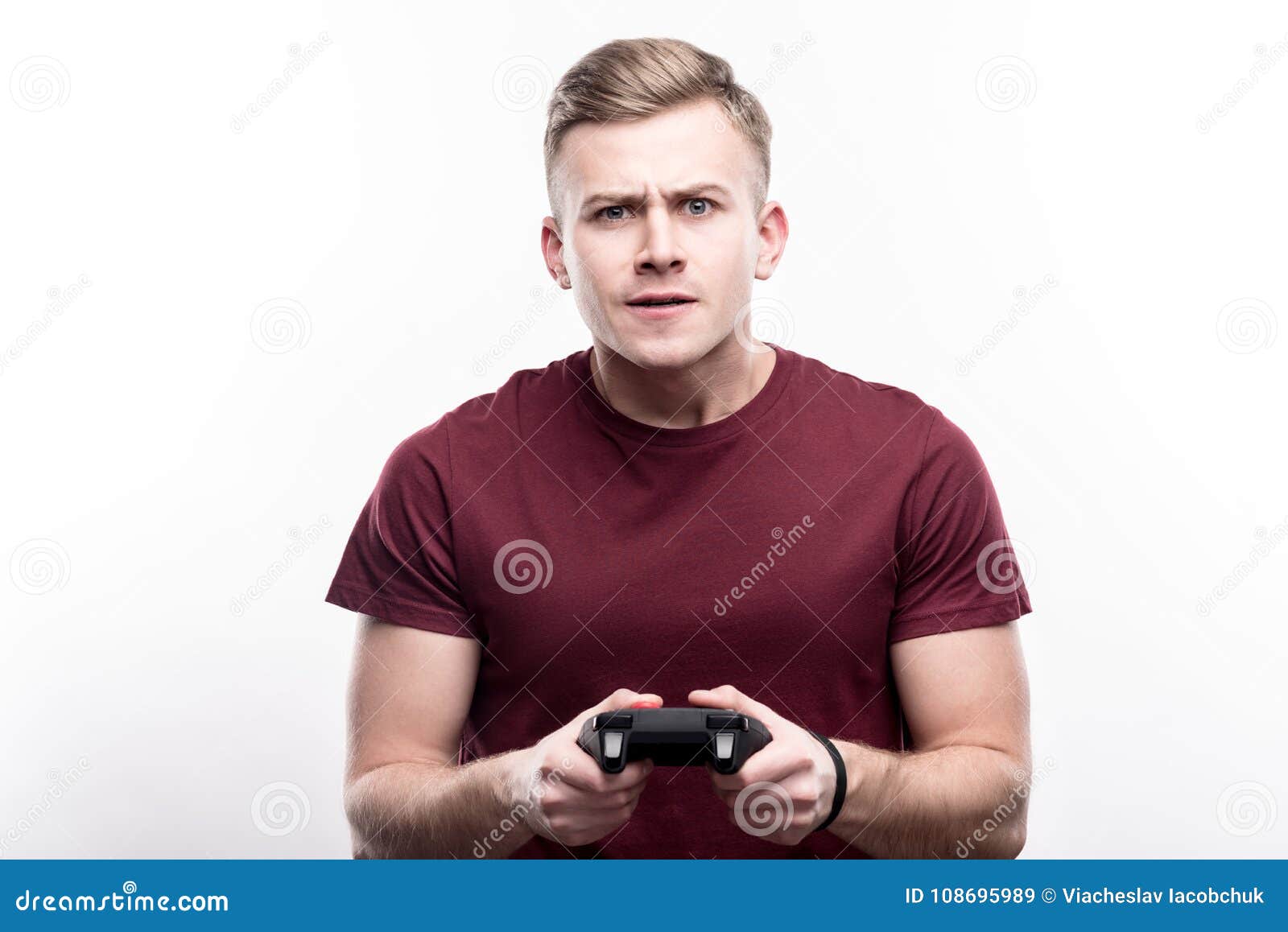 Frustrated Long Haired Gamer Clutching Video Game Controller Stock