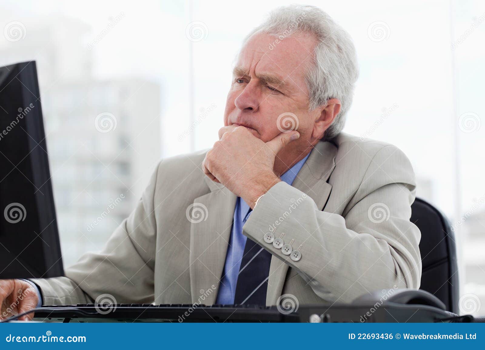 Focused Senior Manager Working with a Monitor Stock Photo Image of
