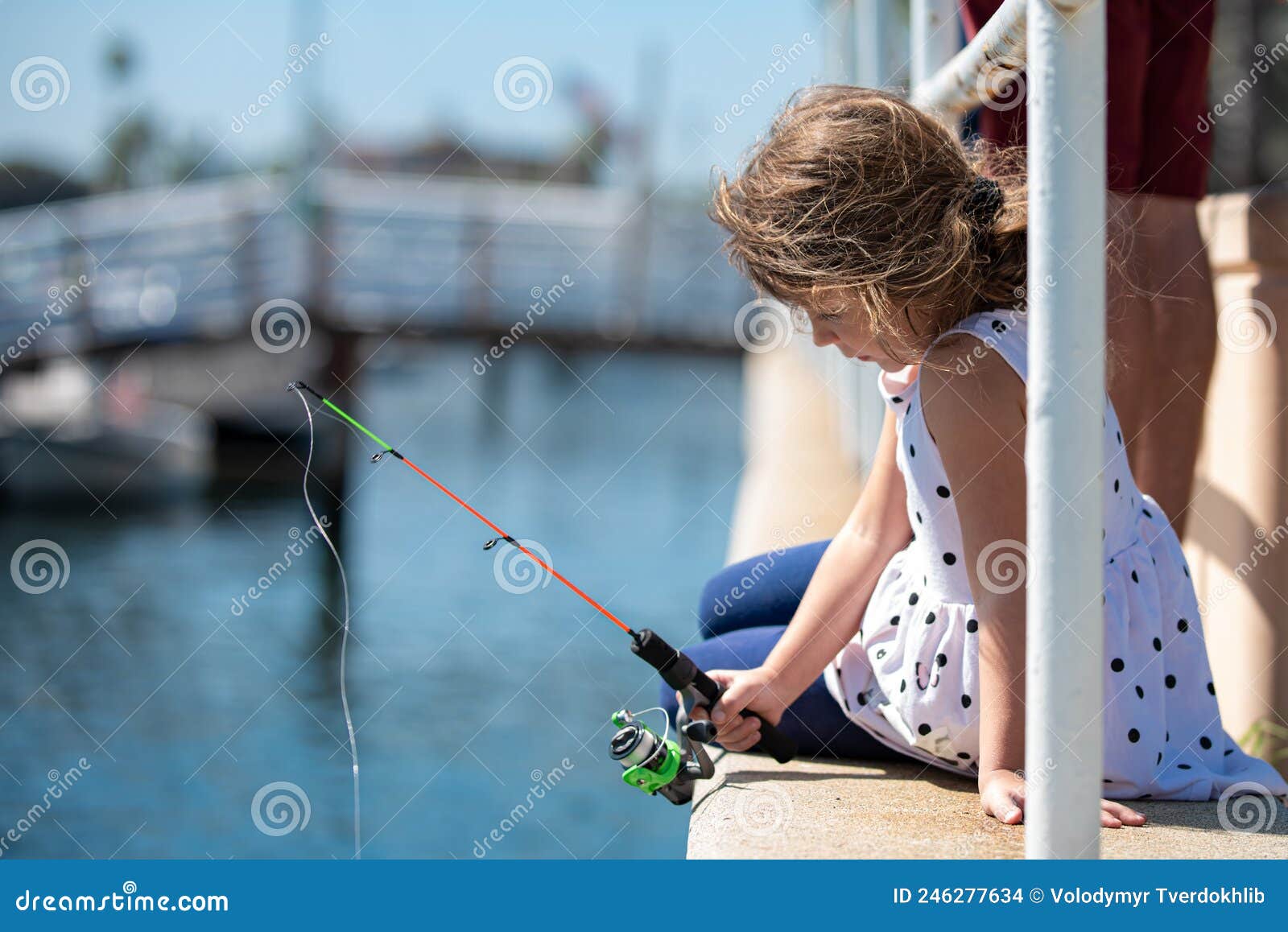 Focused, Serious, Little Children Girl Catch a Fish by a Fishing