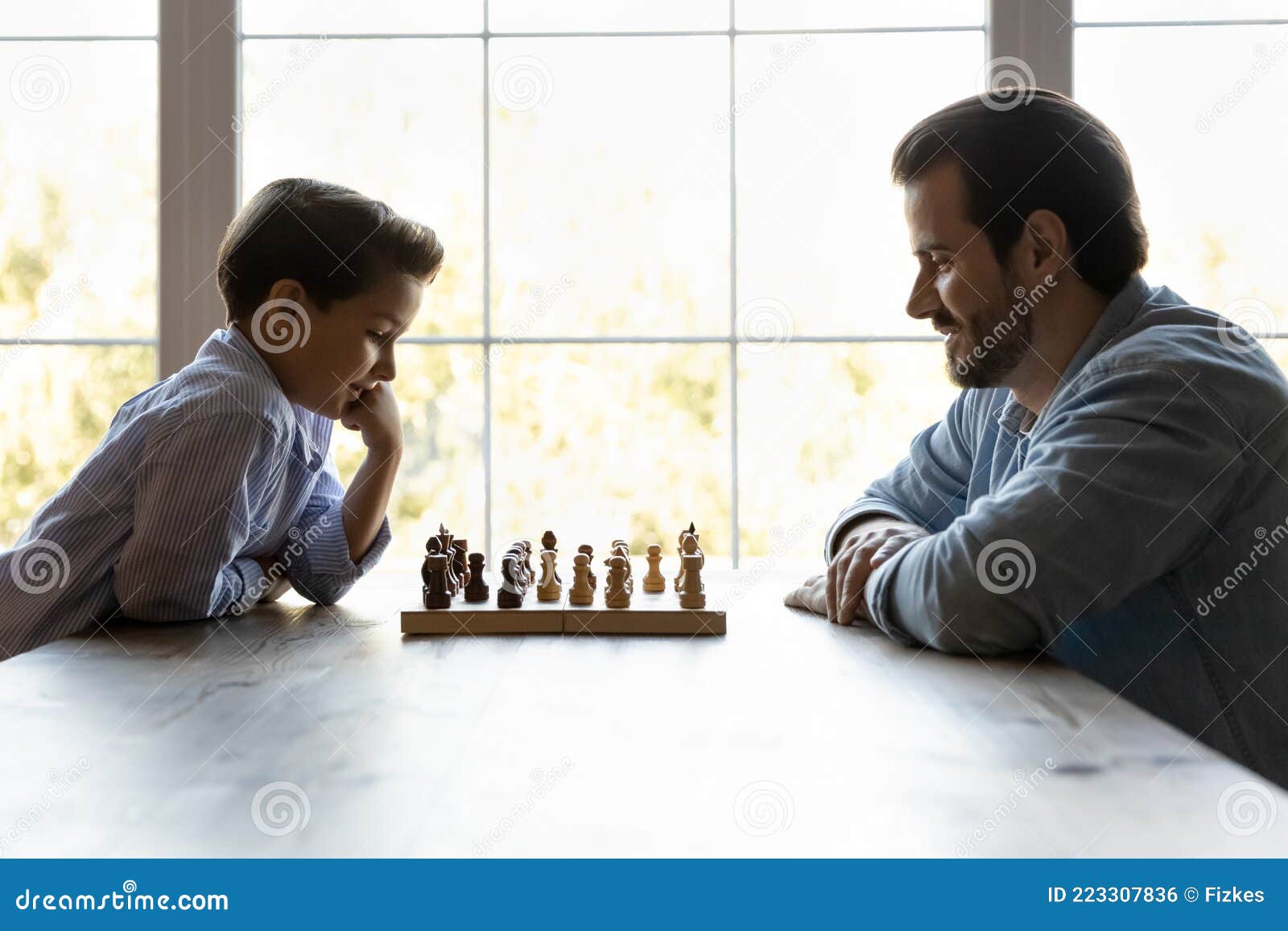 Blonde Woman Playing Chess Online Uses Laptop, Thoughtfully Makes