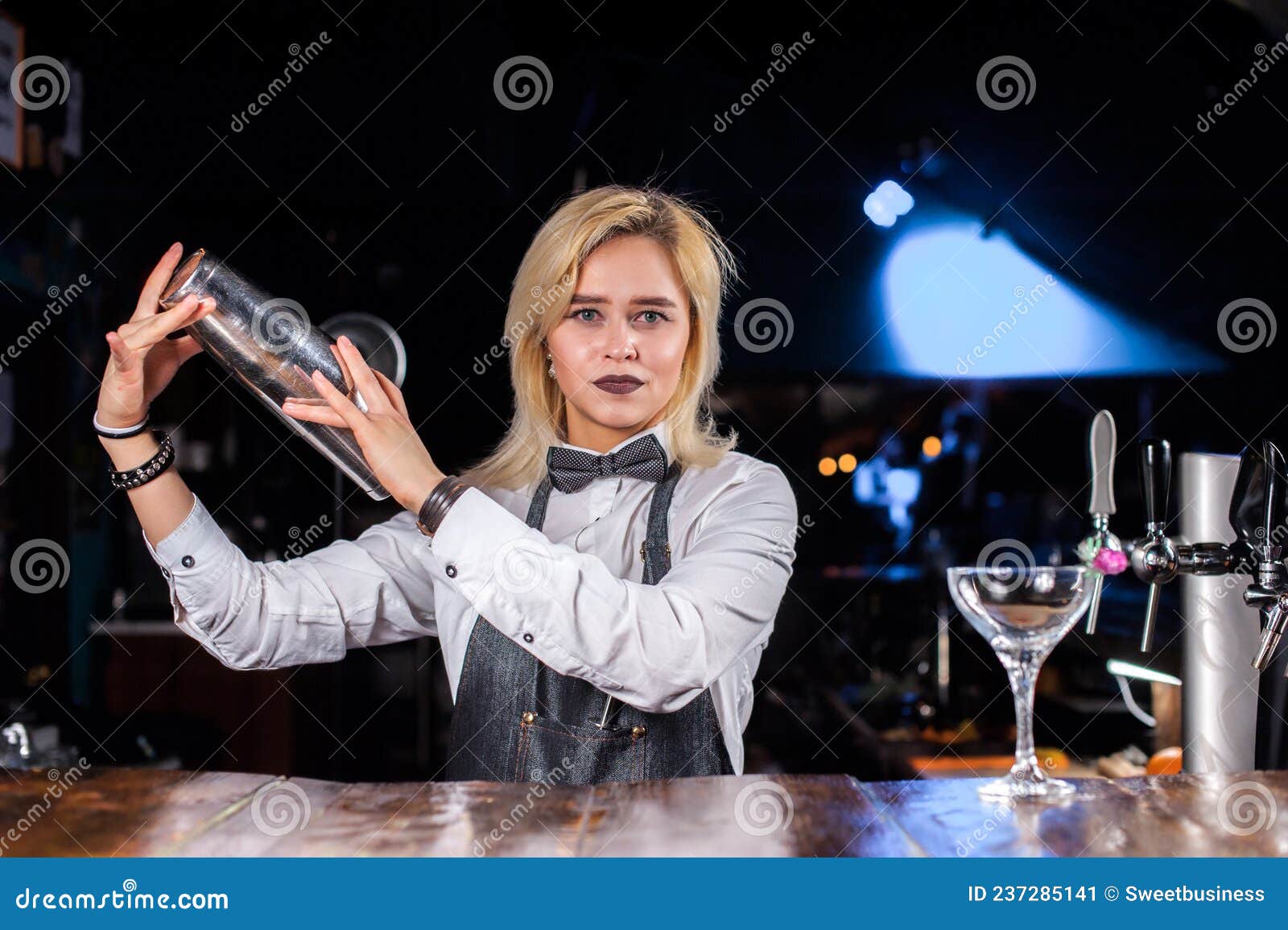 Confident Barmaid Pouring Fresh Alcoholic Drink into the Glasses at the ...