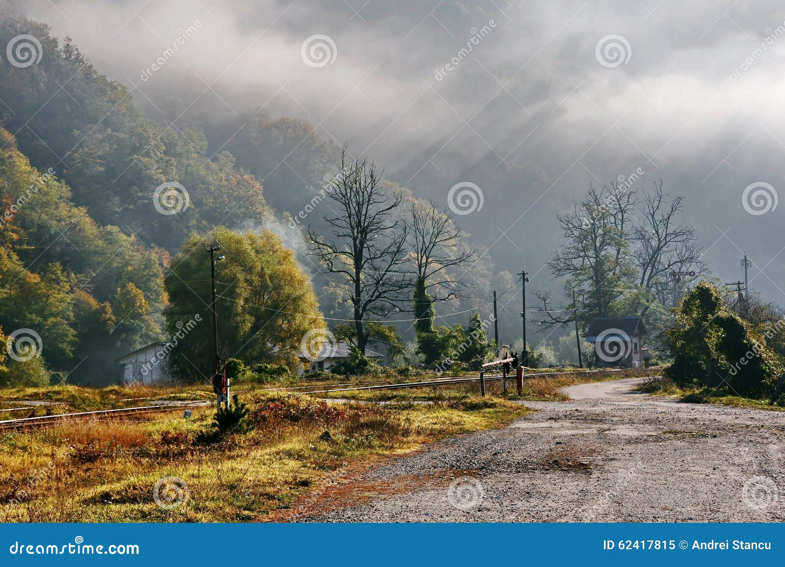 Foggy Autumn Morning in Romania. Foggy autumn morning with old railway and forest in Romania