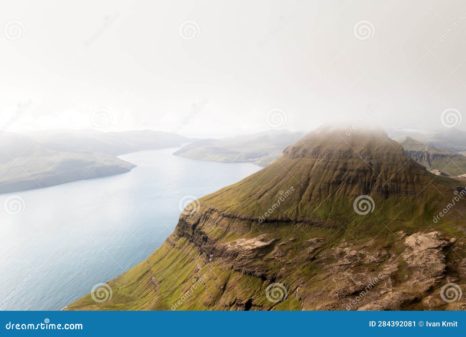 foggy mountain peaks and clouds covering sea and mountains