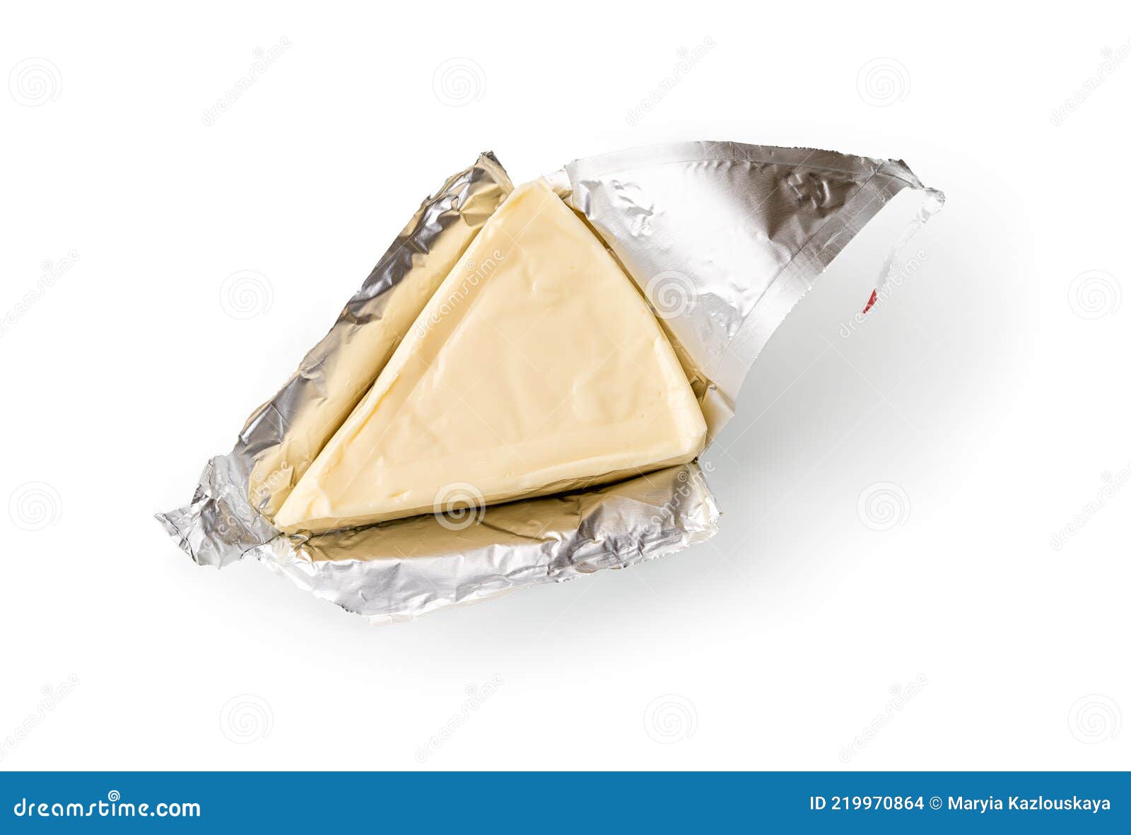 foil wrapped processed creame cheese slice  on a white background. small triangular piece of portioned soft cheese in a
