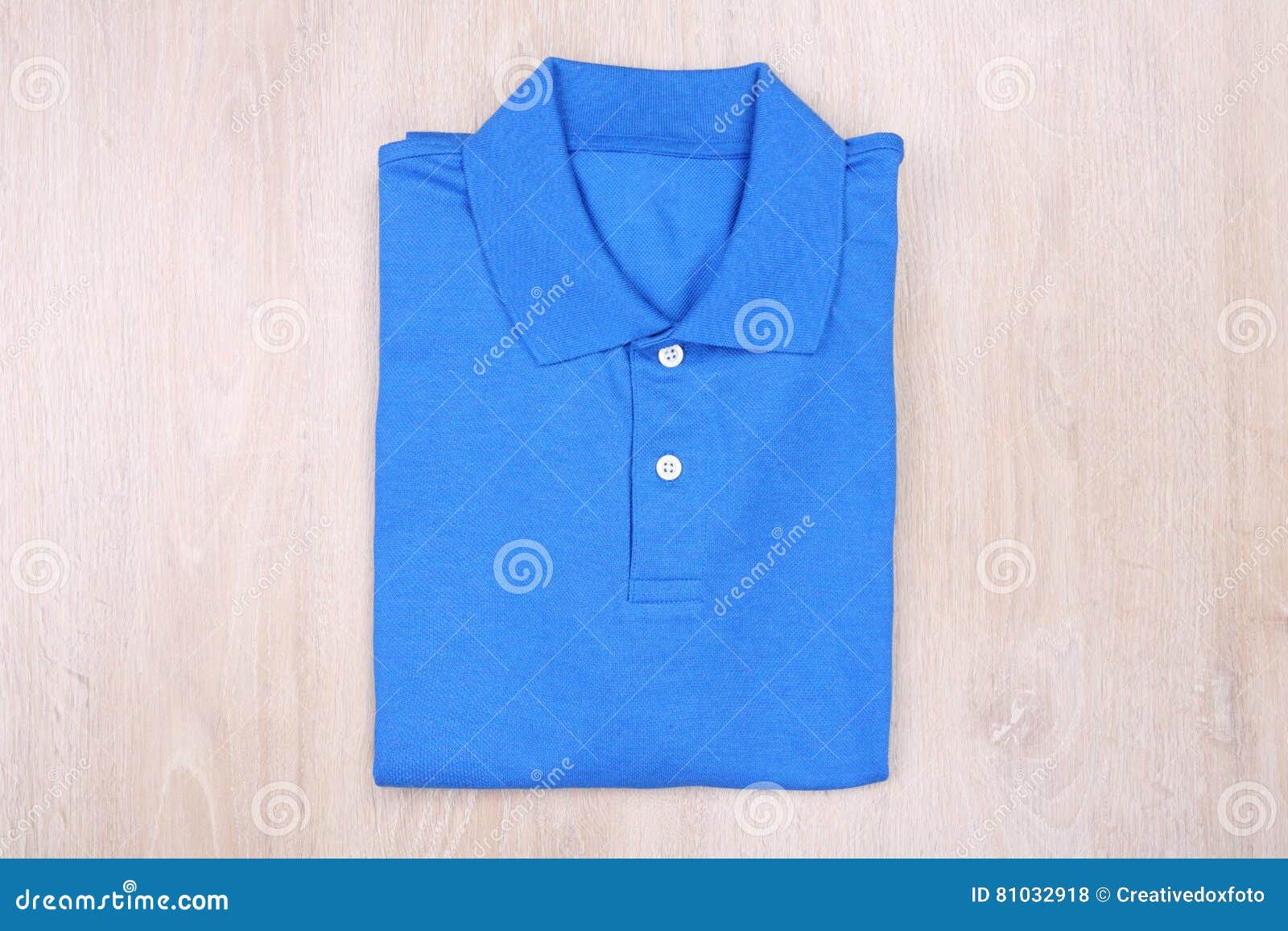 Fold Blue Polo Shirt on Wooden Background Stock Photo - Image of blank ...