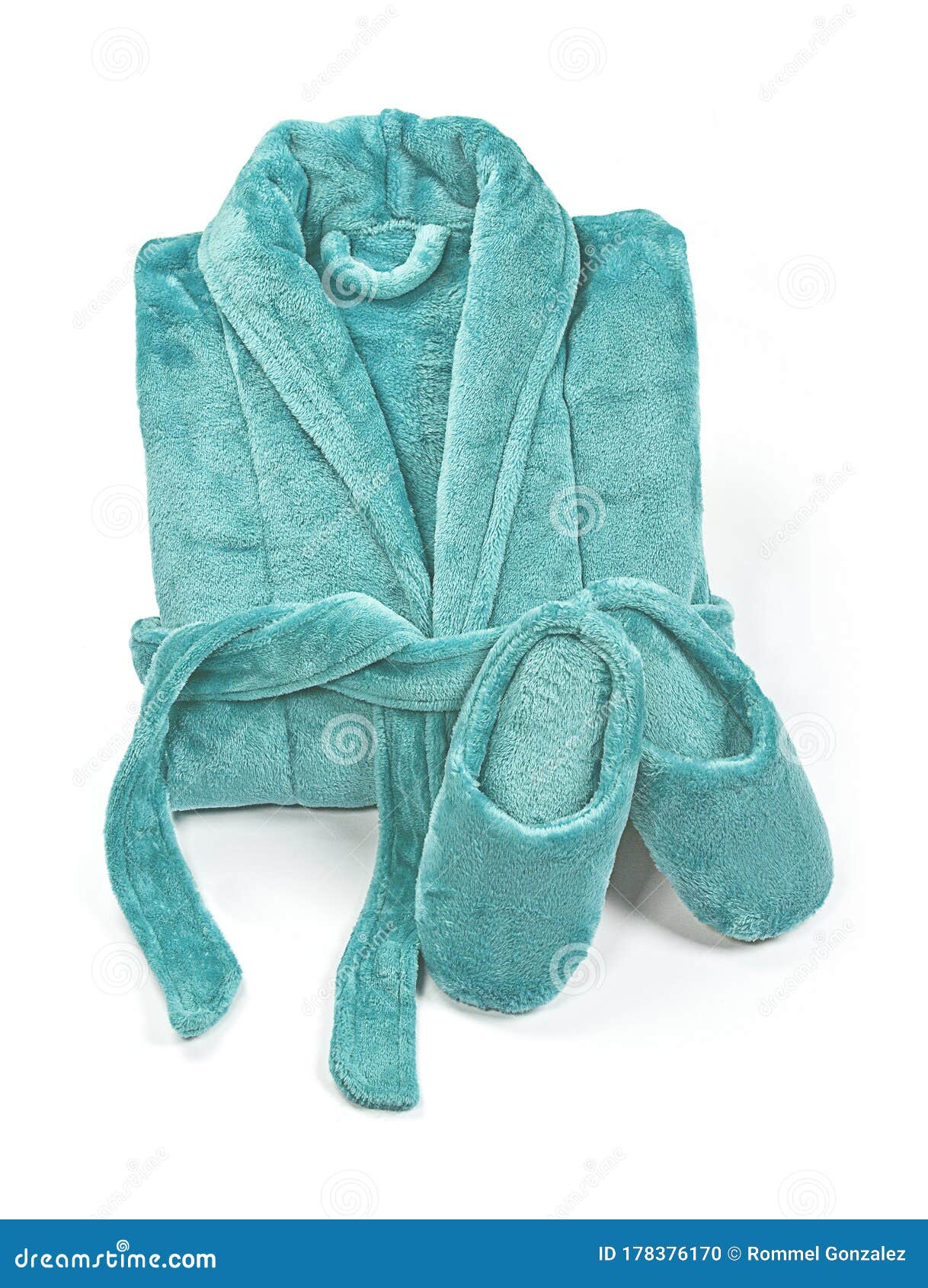 Folded Bathrobe, and Slippers Isolated on White, Top View. Stock Photo