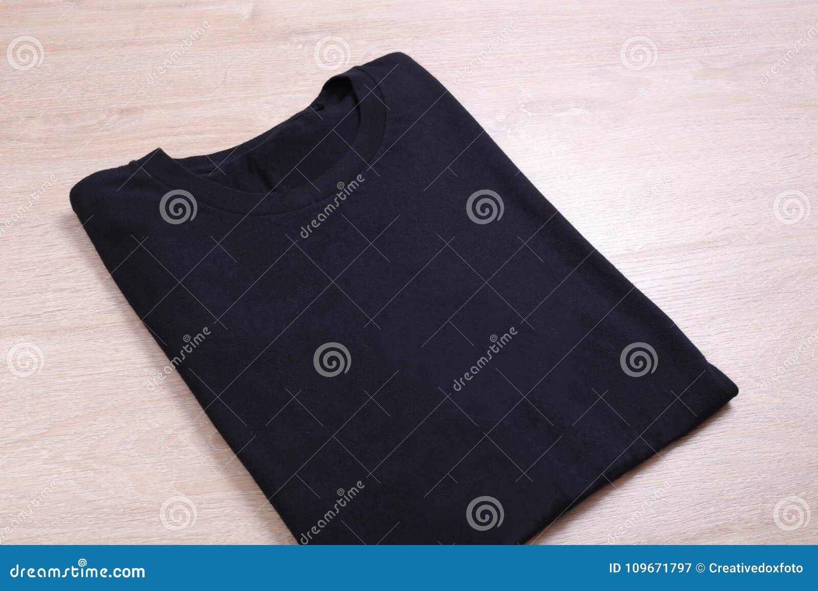 1,275 Folded Black T Shirt Stock Photos - Free & Royalty-Free Stock ...