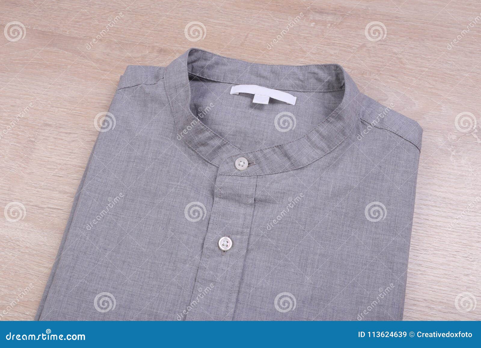 Folded gray casual shirt stock image. Image of garment - 113624639