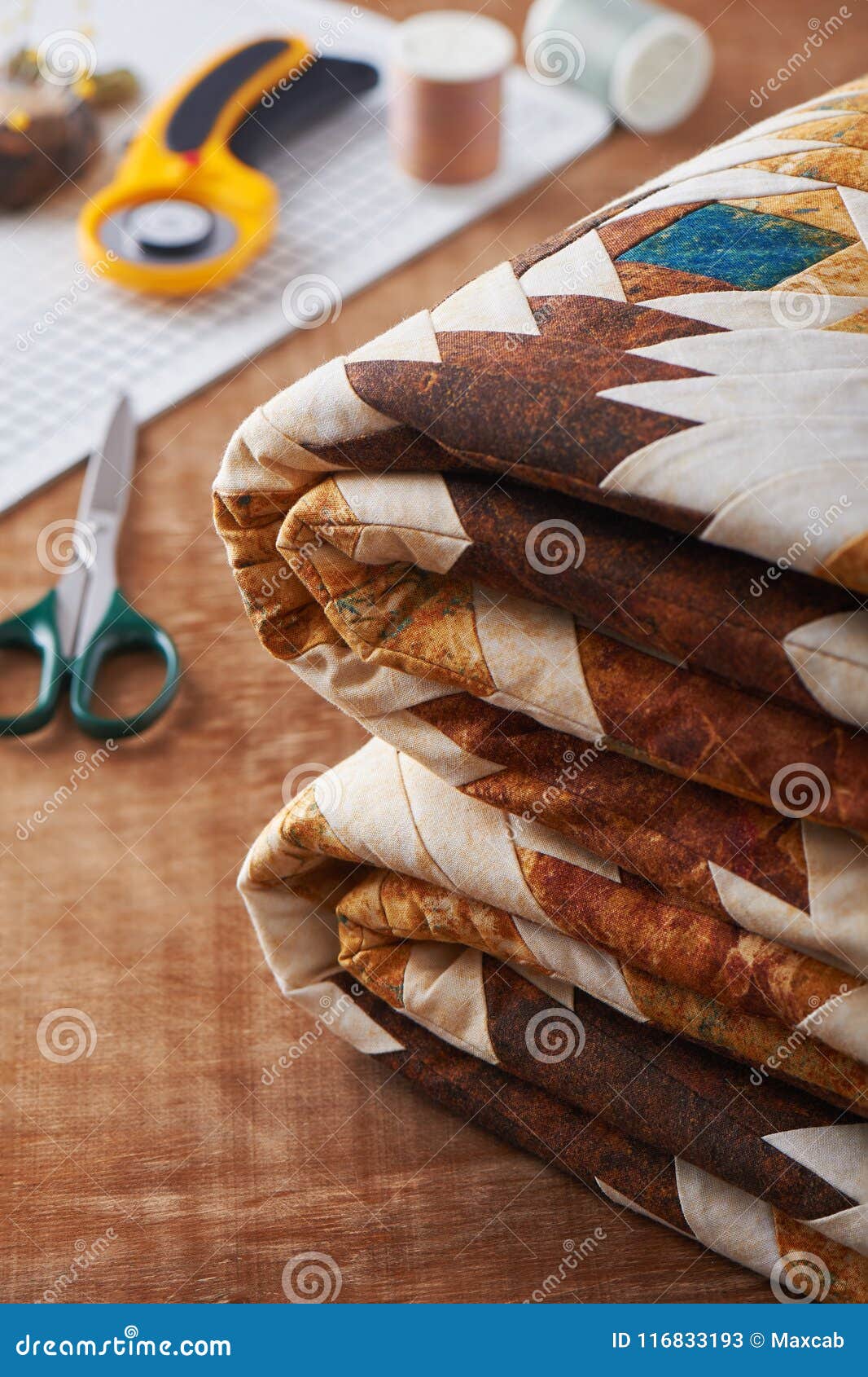 Folded Patchwork Blanket on Wooden Surface on Sewing Accessories ...