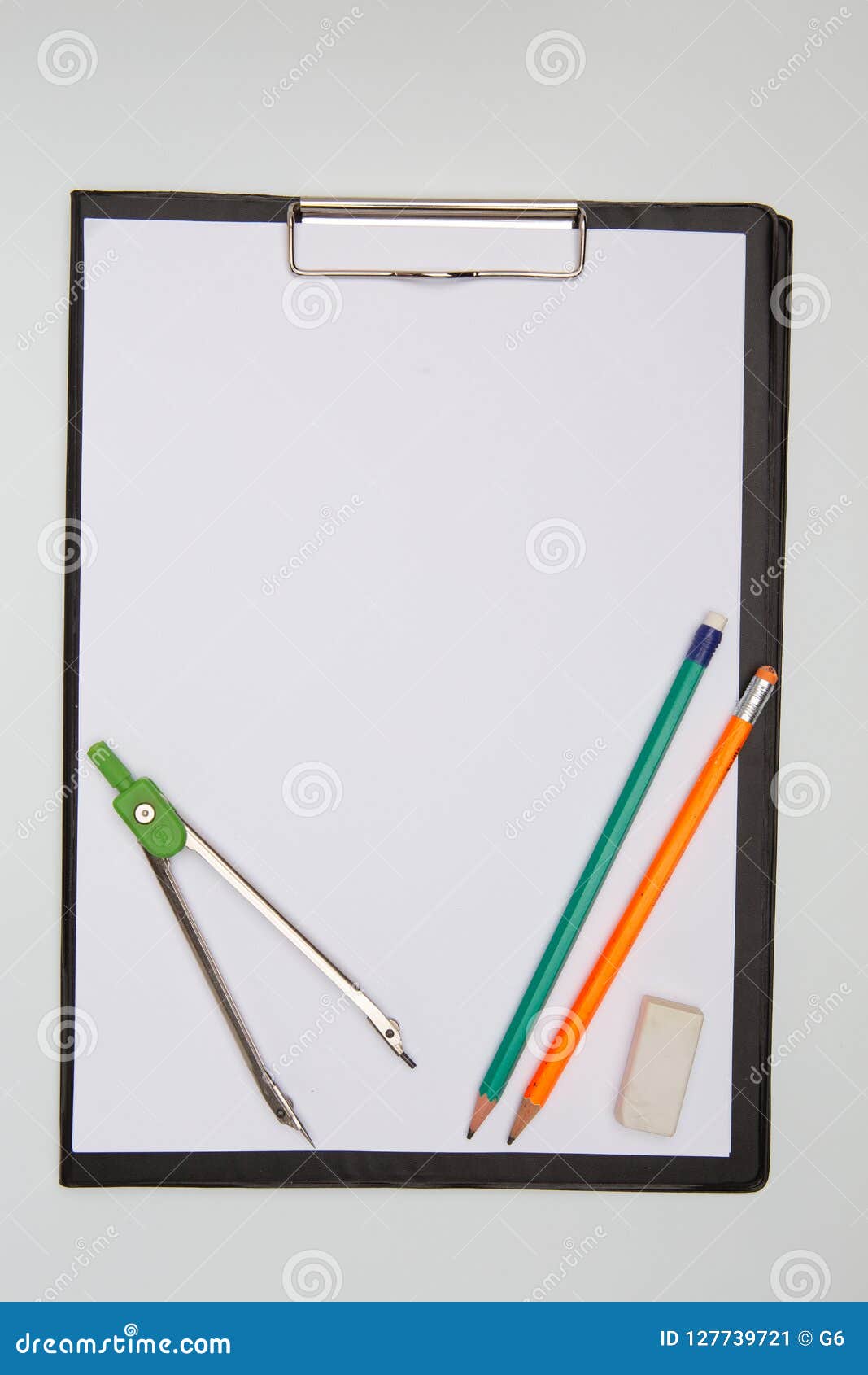 Folder with Blank Sheets of Paper, Compass, Eraser and Pencils on Gray