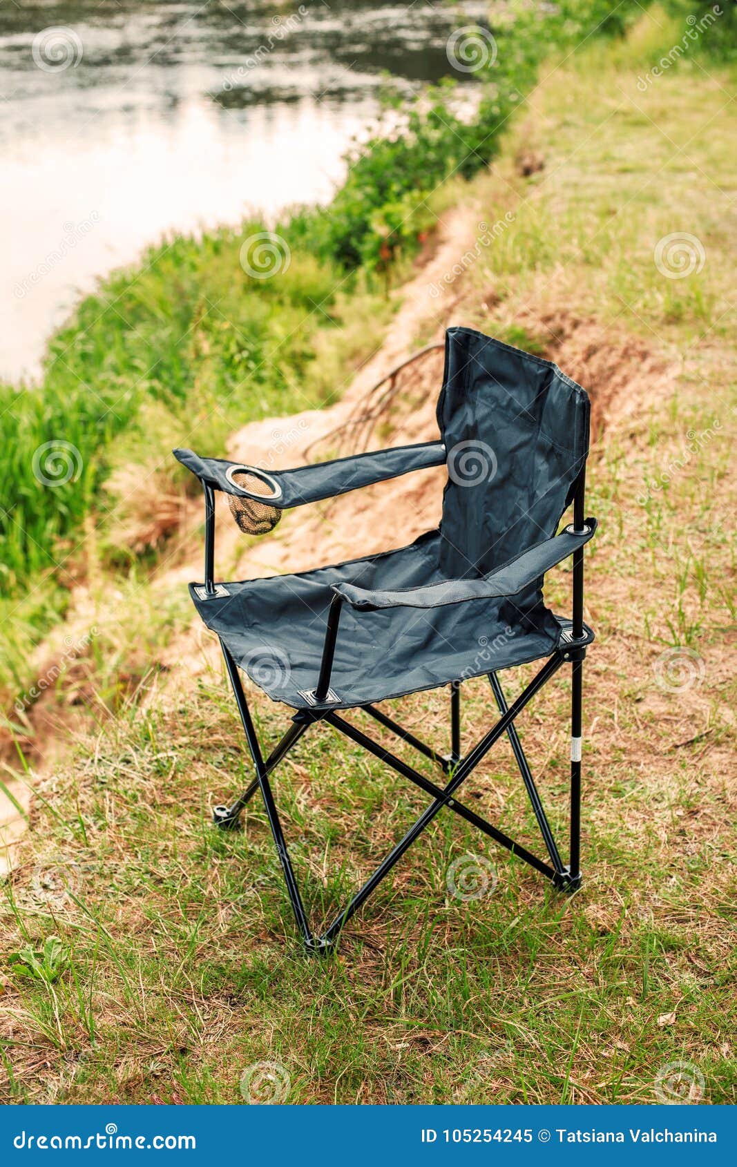 Folding Black Chair for Fishing and Outdoor Relaxation Stock Image