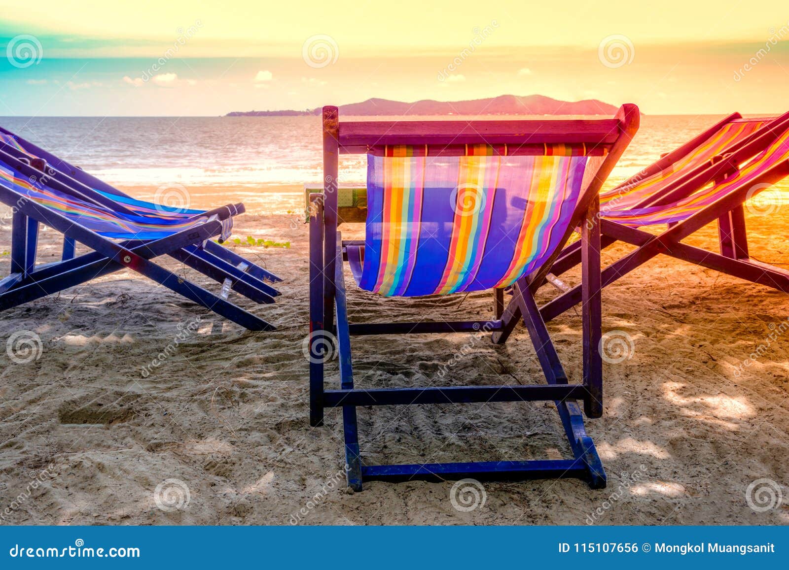 Folding Chair With Blue Color On The Beach In Sunlight With Sea 
