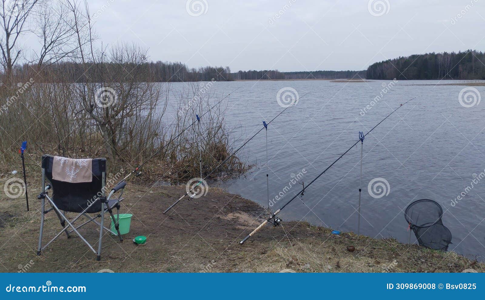 https://thumbs.dreamstime.com/z/folding-fishing-chair-plastic-bucket-bait-cage-feeder-rods-bream-fishing-mounted-stands-ground-next-309869008.jpg