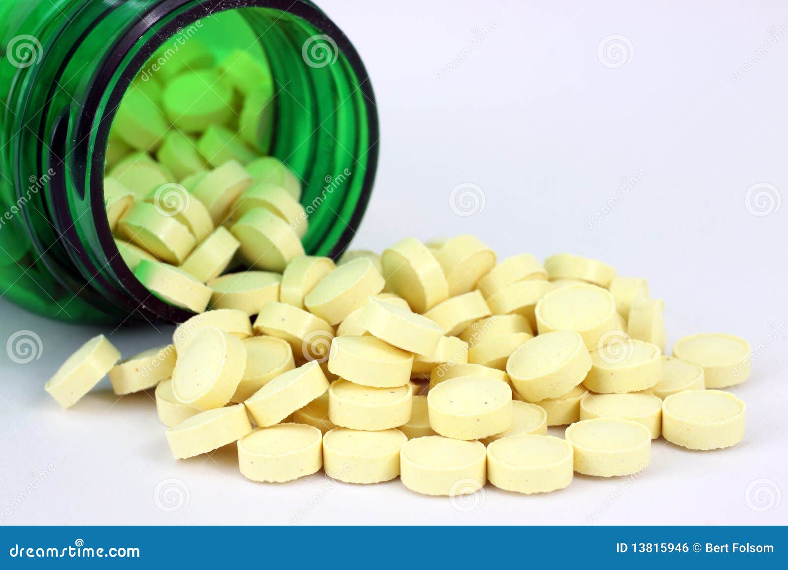Folic Acid Spilling from Green Pill Bottle Stock Photo Image of