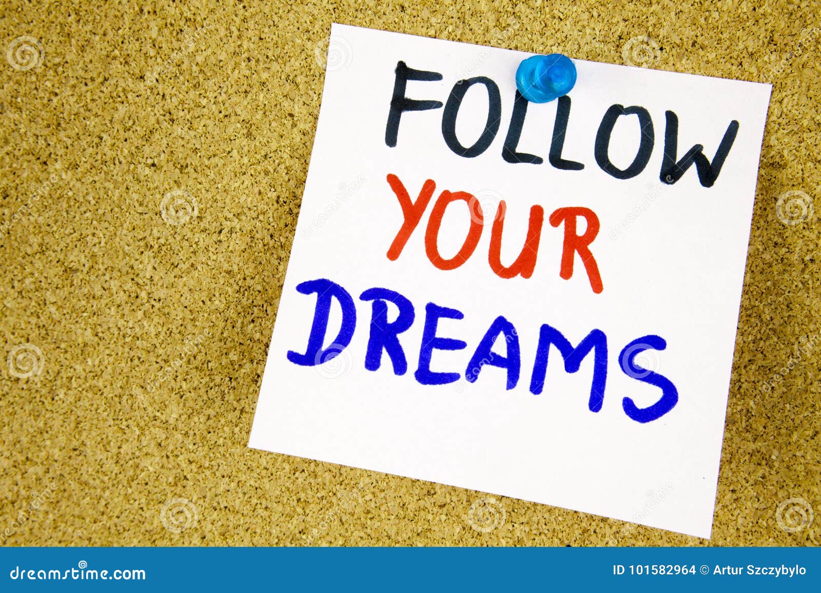 follow your dreams on color sticker notes over cork board background