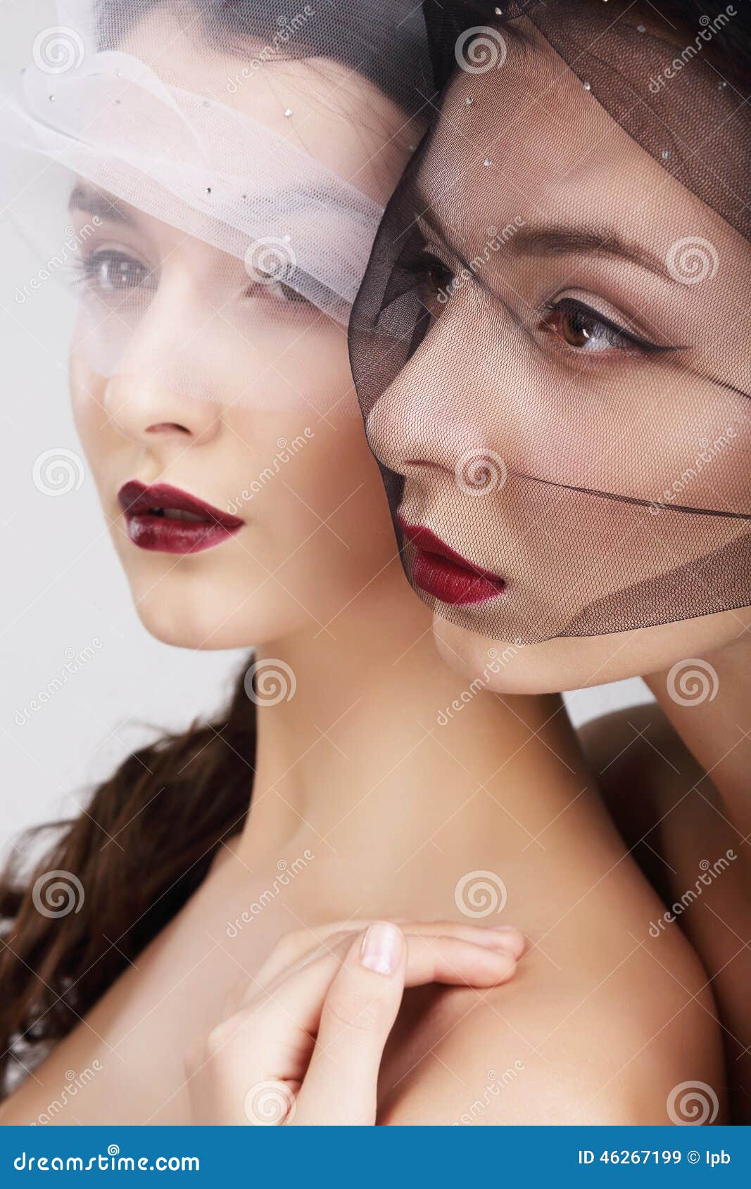 fondness. two females in veils embracing