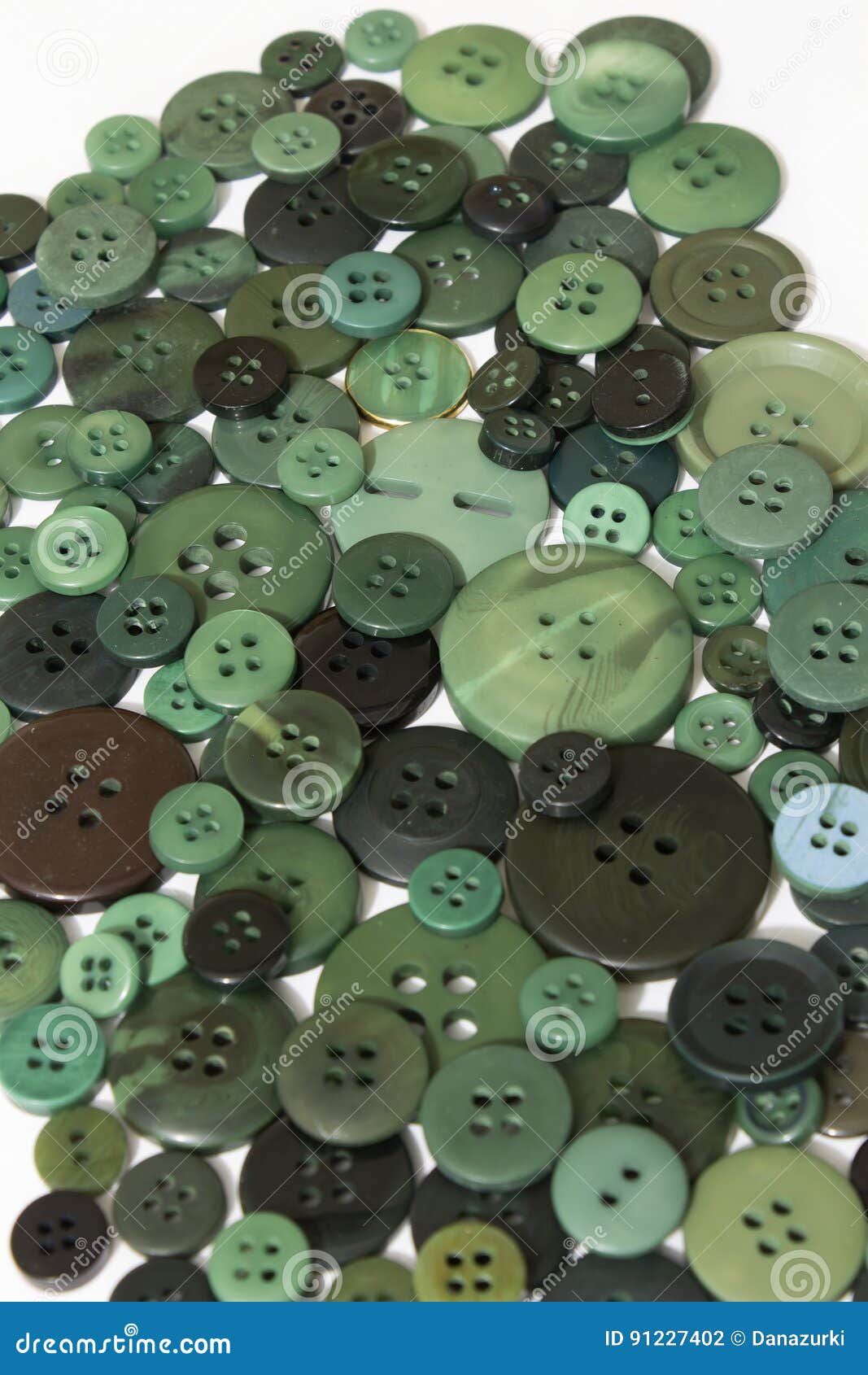Ciò è una fotografia del fondo di cucito verde dei bottoni