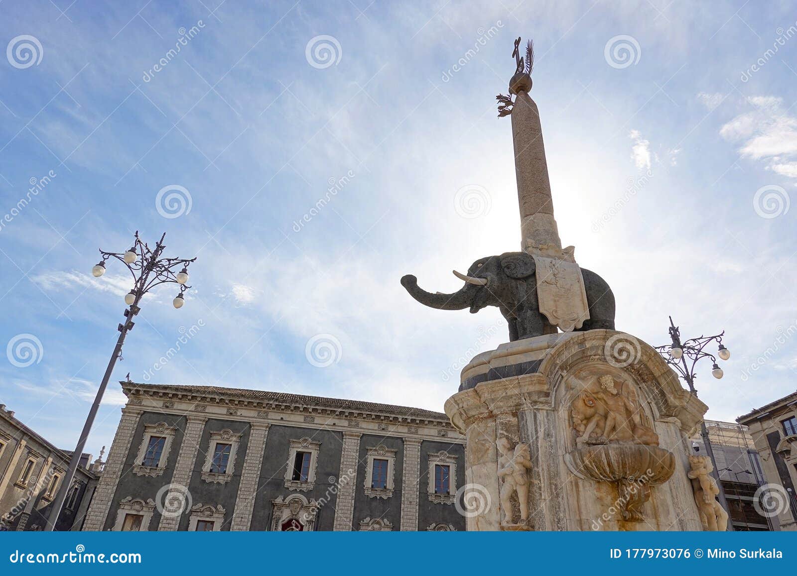 fontana dell elefante obelisk in the center of piazza del duomo in catania, sicily in strong backlight