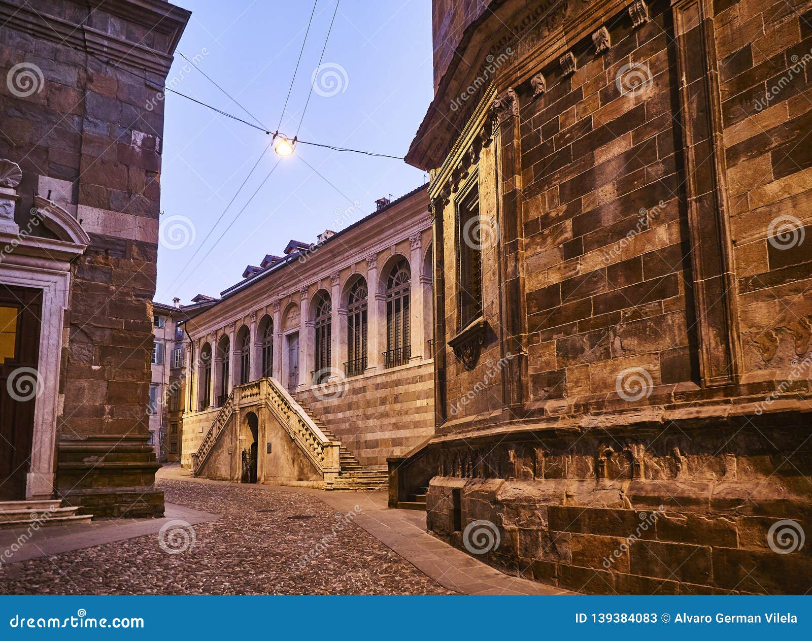 the fontanone visconteo at nightfall. view from piazza del duomo. citta alta, bergamo, lombardy, italy