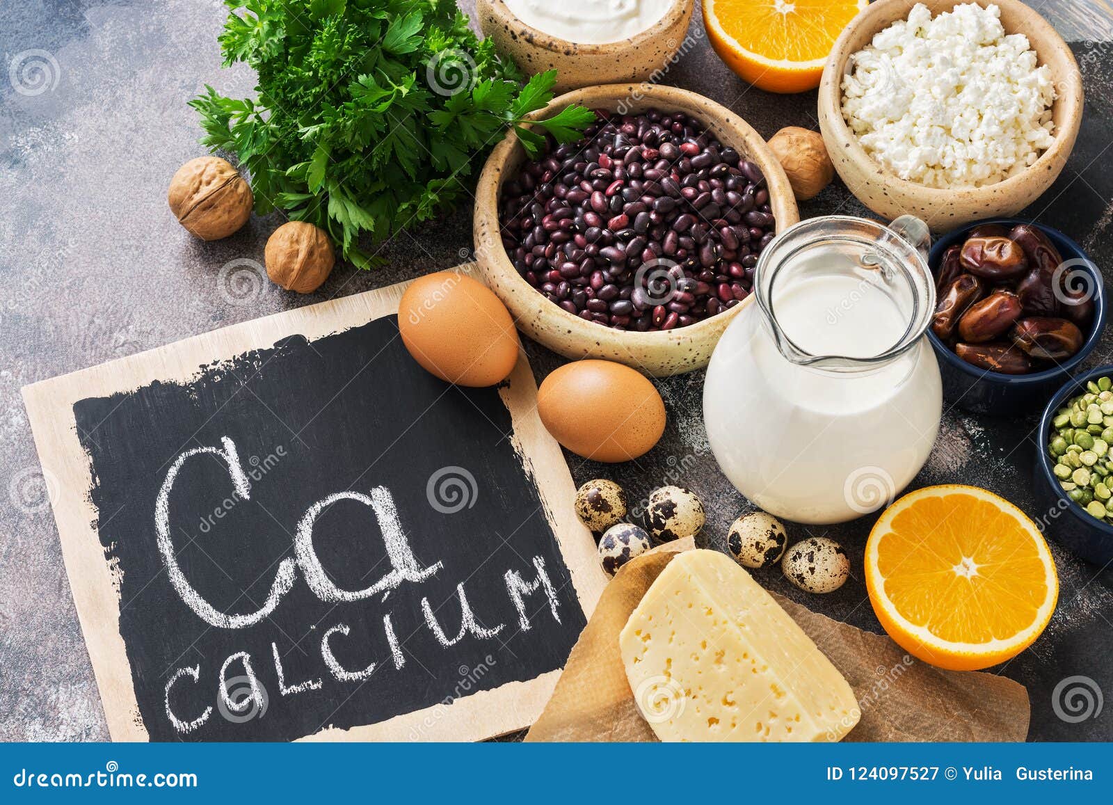 food with calcium. a variety of foods rich in calcium. signboard with the word-calcium. top view.