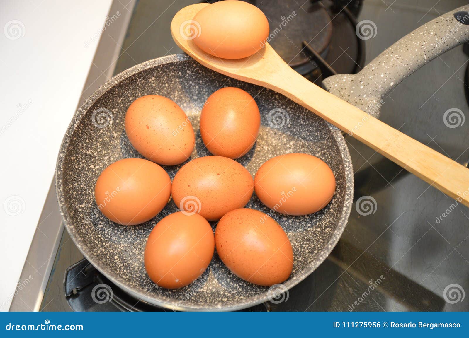 Fresh eggs in cooking pan stock photo. Image of eggs 111275956