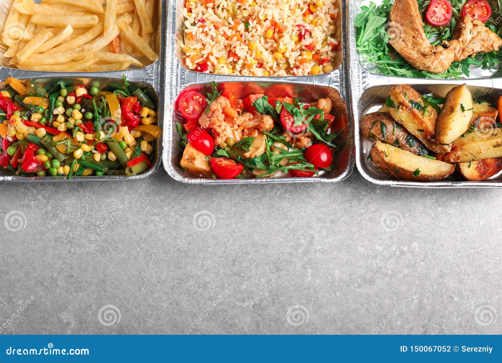 Food Delivery Containers with Different Meals on Light Table, Top View