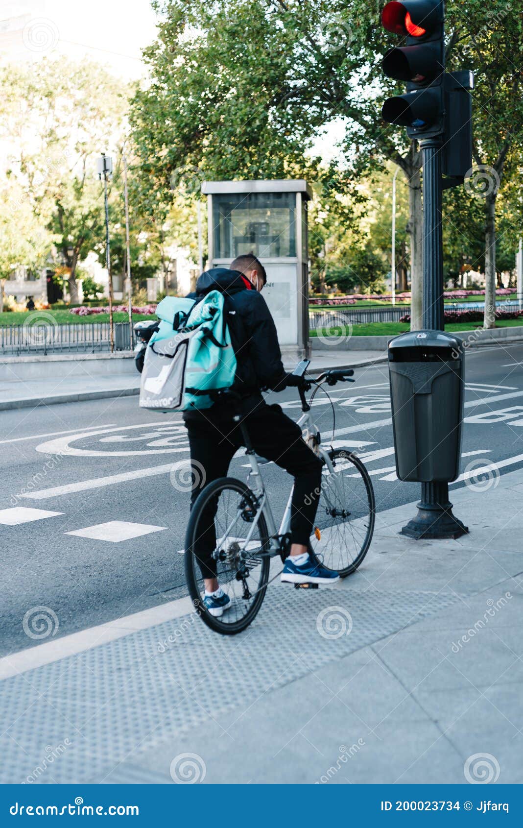 Food Delivery Rider Checks New Orders in His Smart Phone while Holding