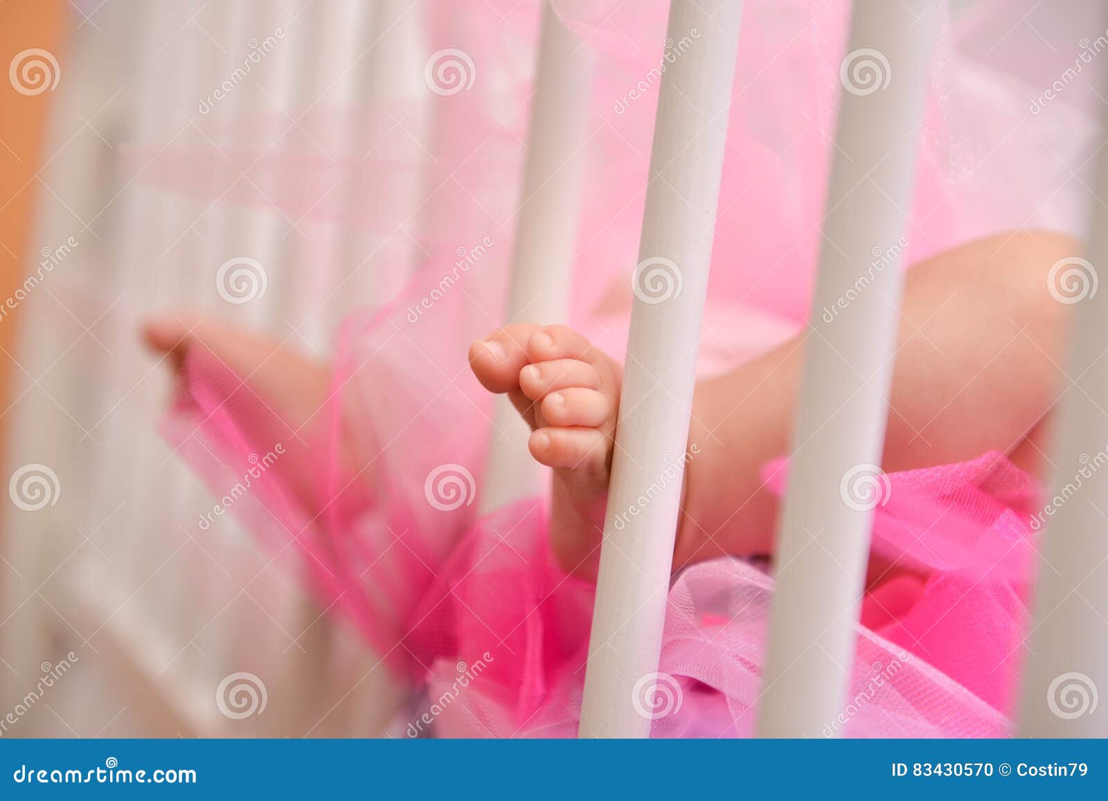 Foot baby in the crib stock photo. Image of beauty, little 83430570
