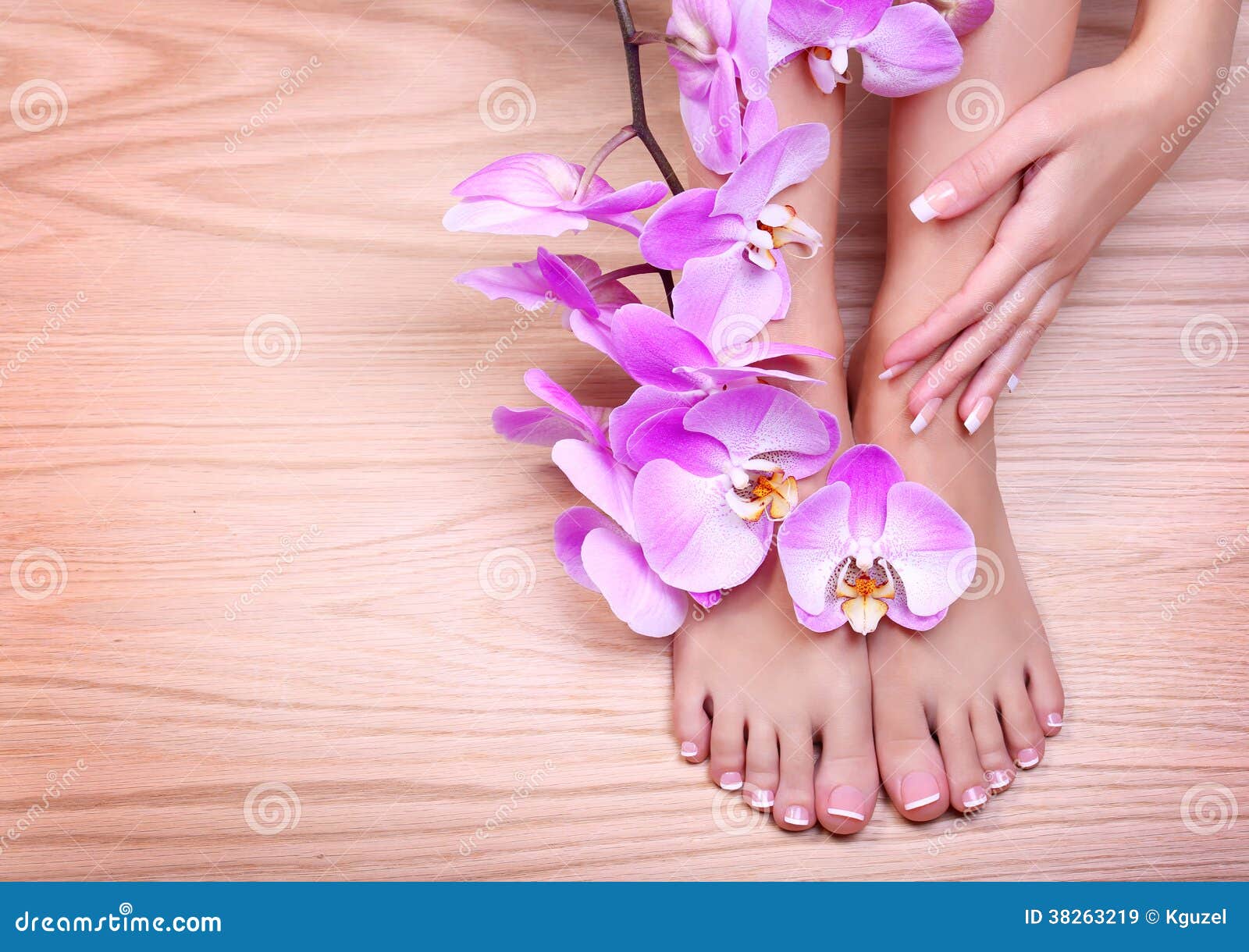 foot care. pedicure with pink orchid flowers on wo